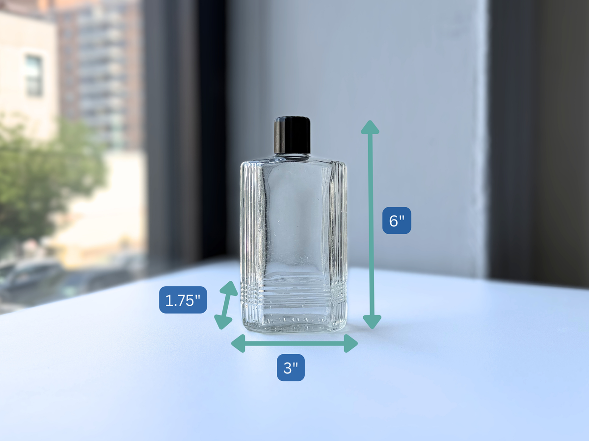 Mennen bottle with dimension overlay showing 6 inch height, clear Art Deco glass
