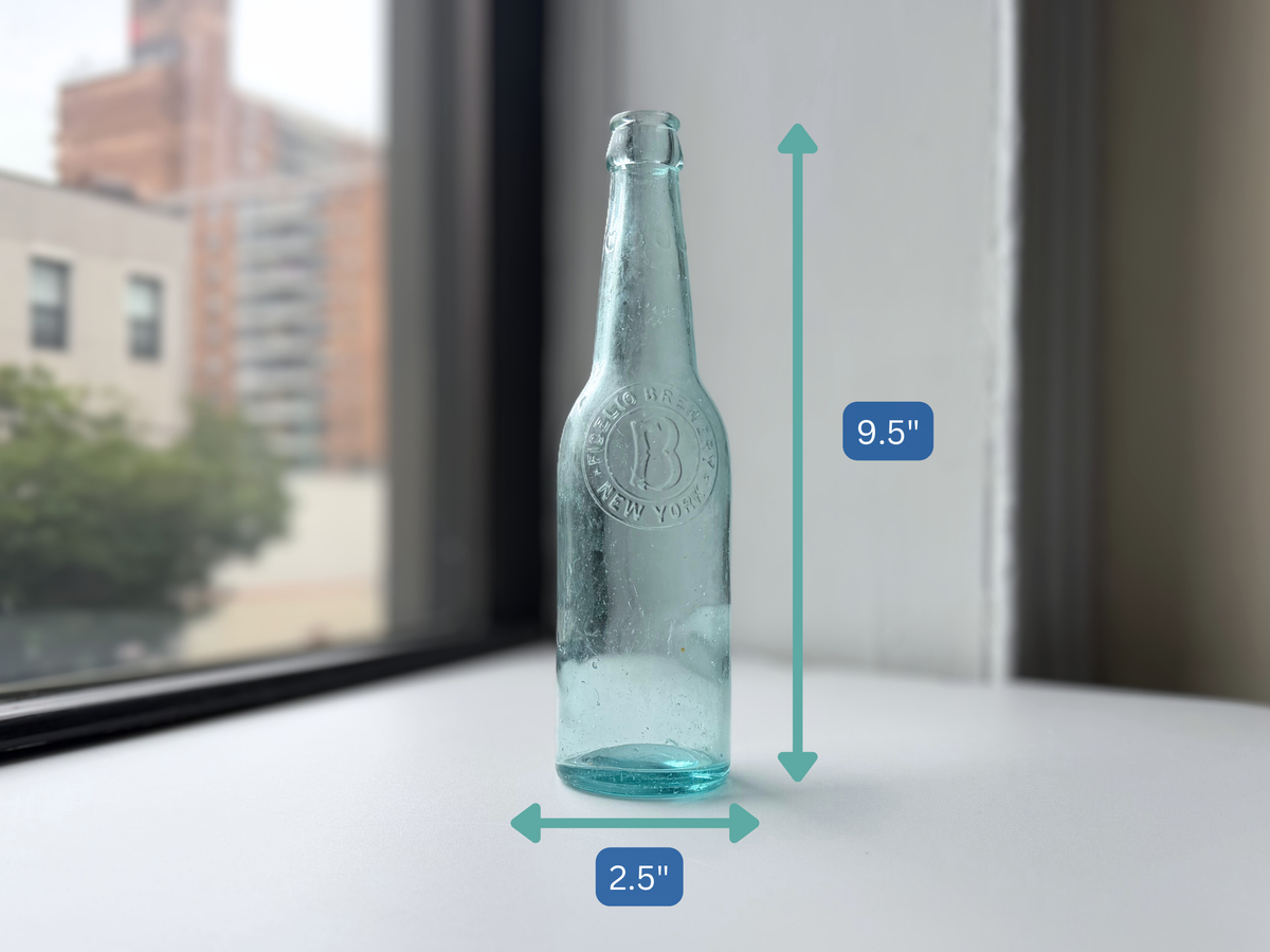 Fidelio Brewery aqua glass bottle with height measurement overlay showing 9.5 inches.