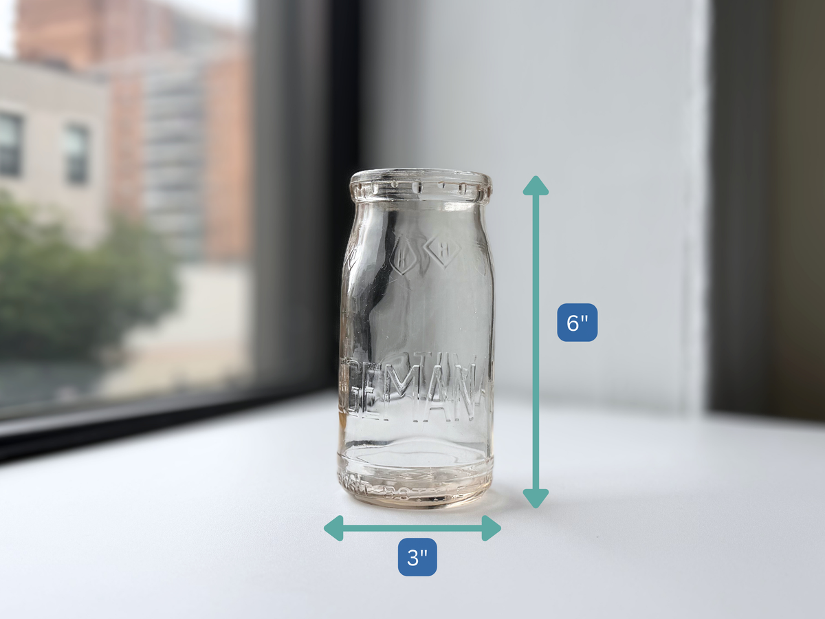 Hegeman Farms milk bottle with height measurement overlay showing 6 inches.