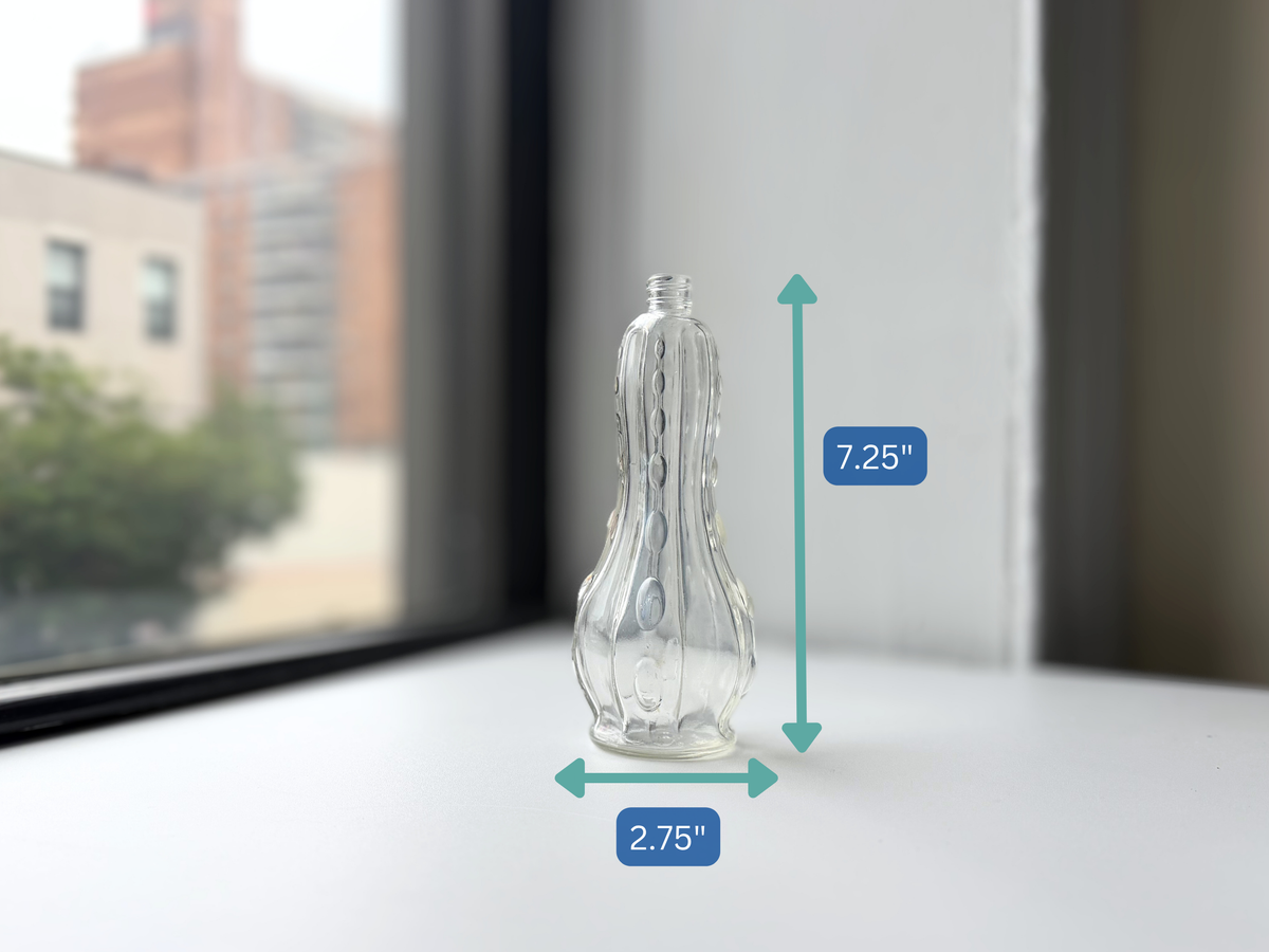 Teardrop textured glass bottle with height measurement overlay showing 7.25 inches.