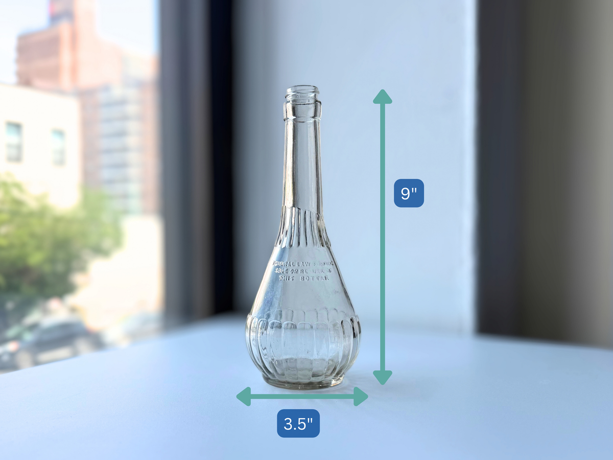 Dimensions of the vintage genie bottle at 9 inches tall and 3.5 inches wide