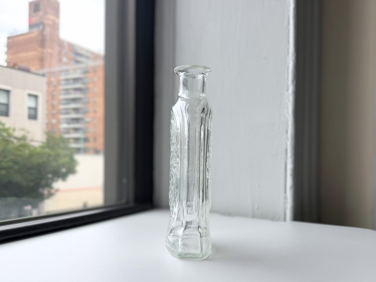 Schenley decanter on a windowsill at an angle.