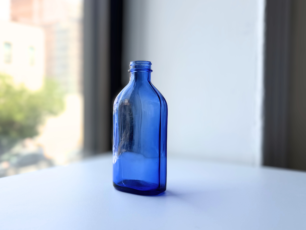 Phillips cobalt blue bottle close view on windowsill
