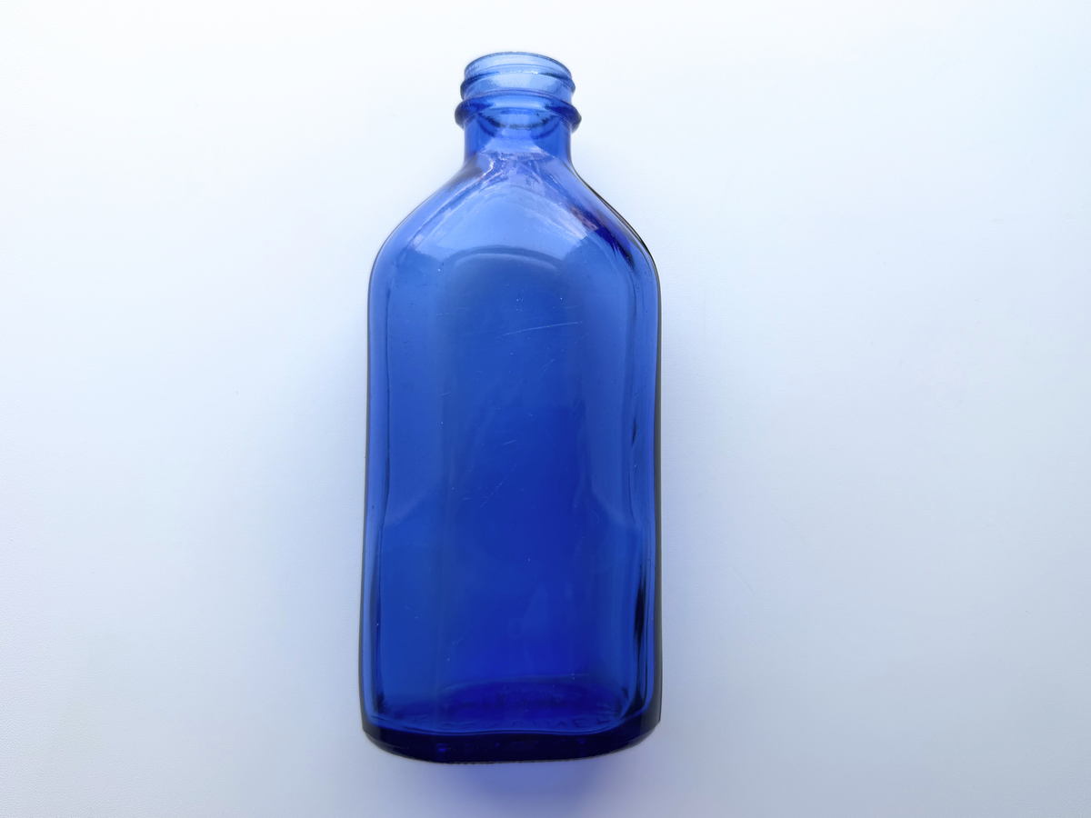 Tall Phillips cobalt blue bottle front product shot on plain background