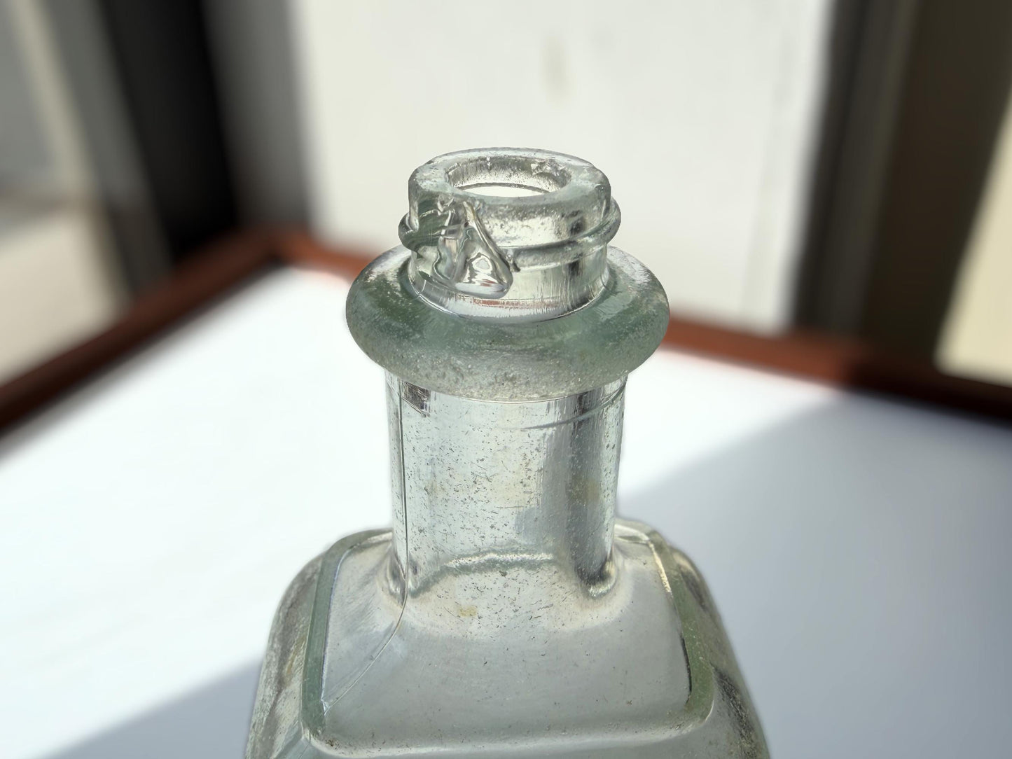Antique aqua Polymol Hair Dressing bottle with genuine sea-worn ocean patina. Early 20th century New York glass transformed by decades at sea into frosted sea glass. Perfect beach house decor and vintage collector piece.