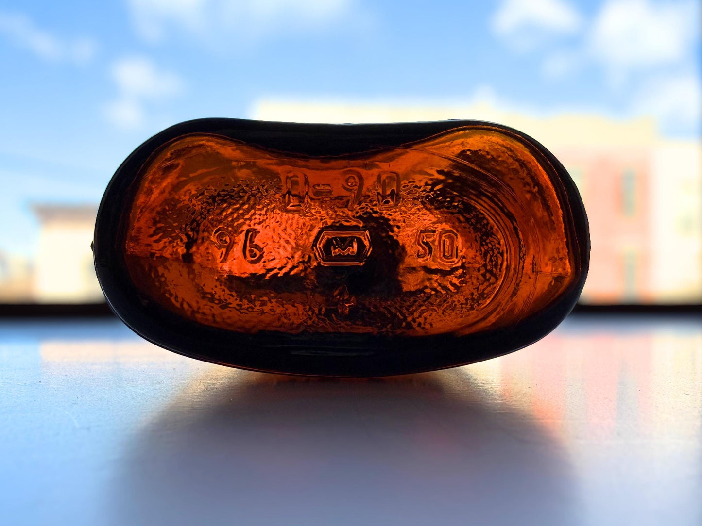 Vintage 1950s amber glass flask close-up – Brooklyn Sea Glass