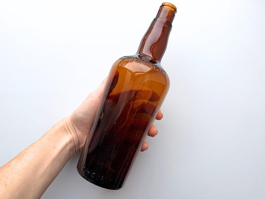 Vintage 1951 wide shoulder whisky bottle with distinctive shape and Owens Illinois marking. Excellent condition. Perfect for collectors of unusual bottle shapes.