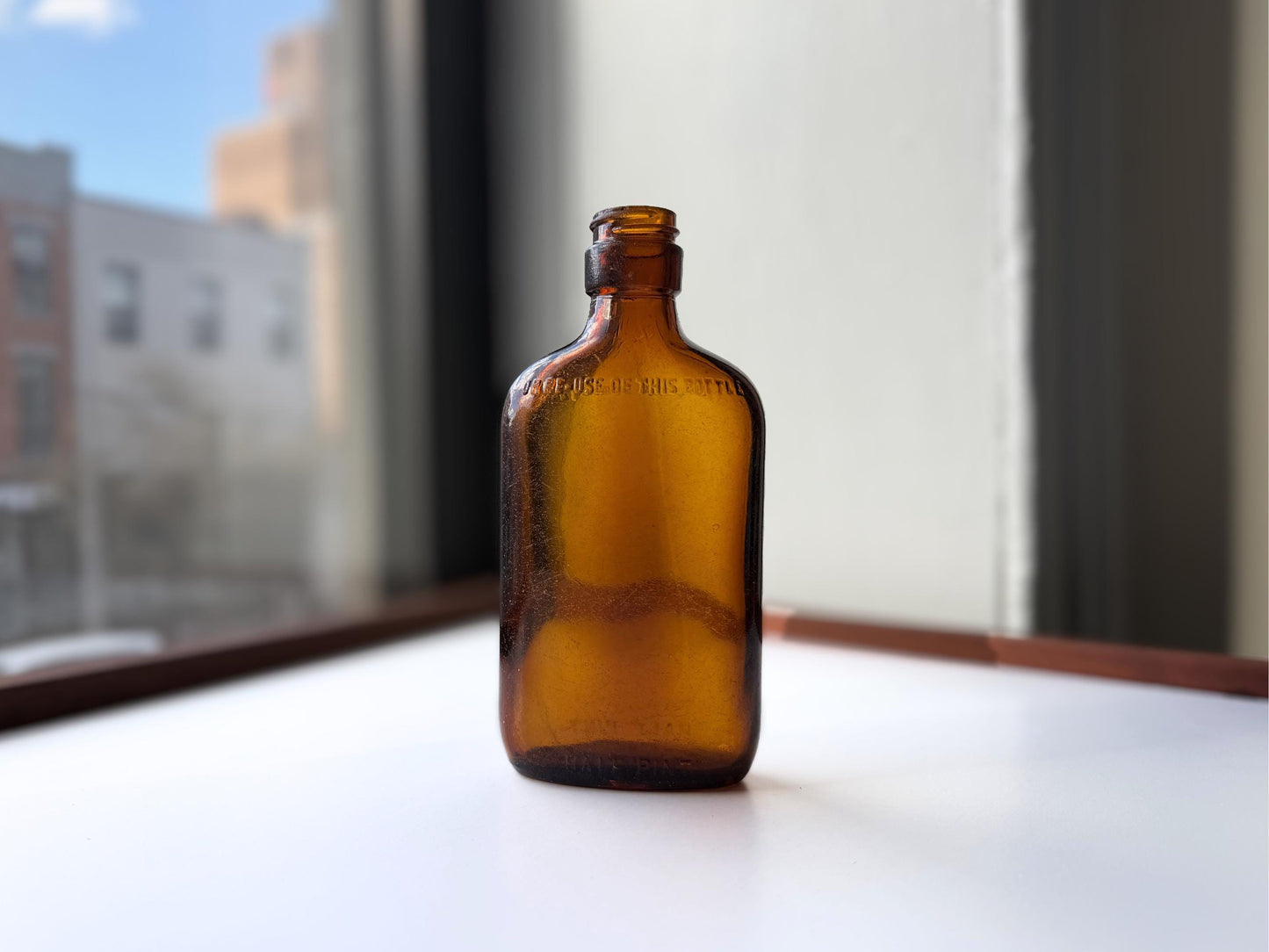 Vintage amber Federal Law flask 6.75 inches tall with beach-worn patina throughout - small chip on mouth - hand-recovered from NYC mid-century dumping grounds