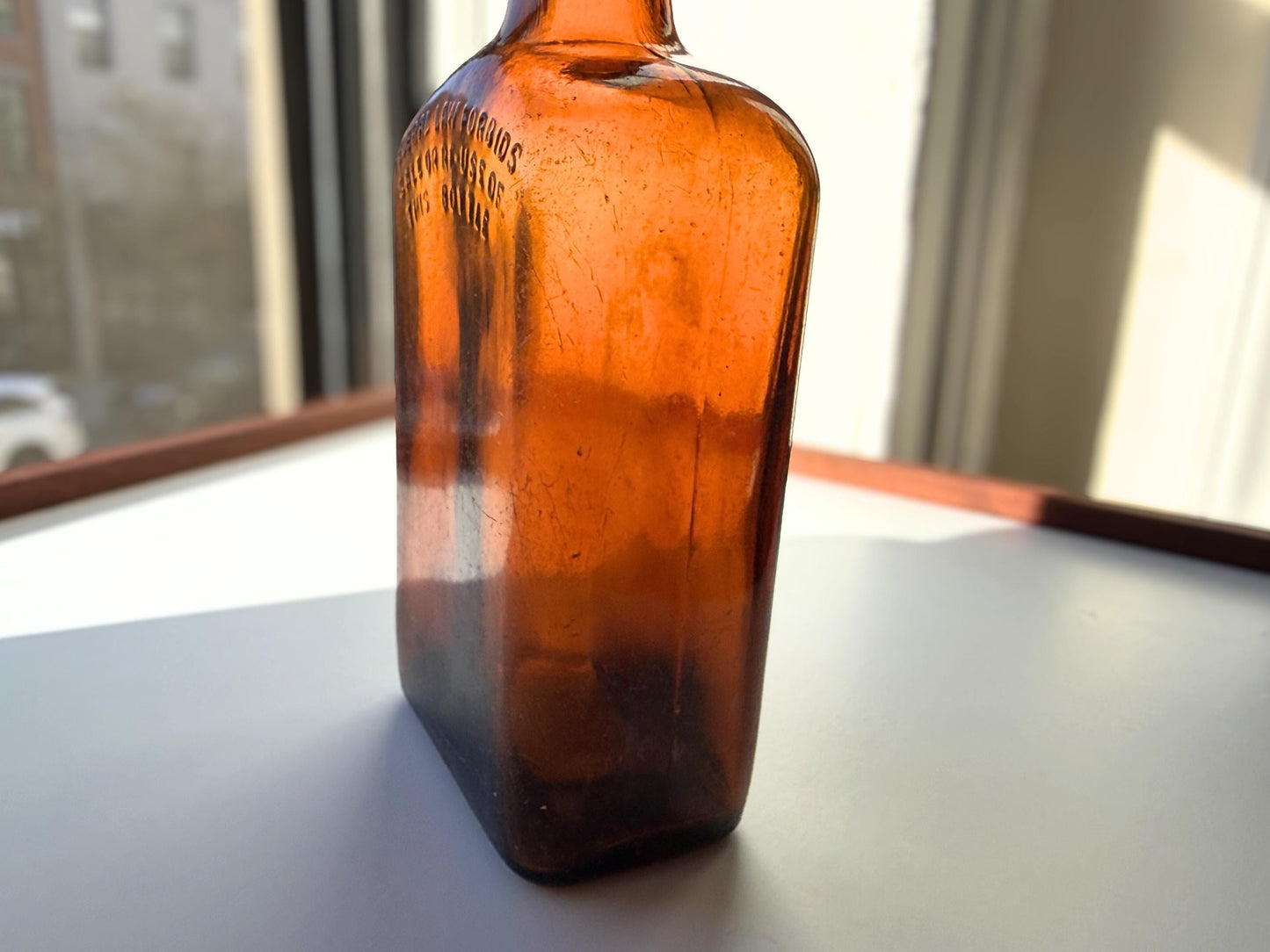 Vintage Bloch Brothers whisky bottle from Glasgow Scotland with distillery marking. Good condition showing minor scratches. Perfect for Scottish whisky collectors.