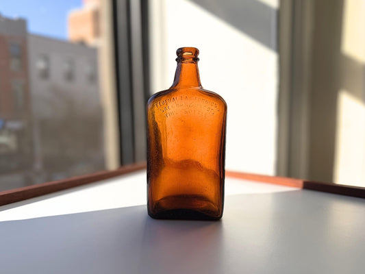 Vintage Bloch Brothers whisky bottle from Glasgow Scotland with distillery marking. Good condition showing minor scratches. Perfect for Scottish whisky collectors.
