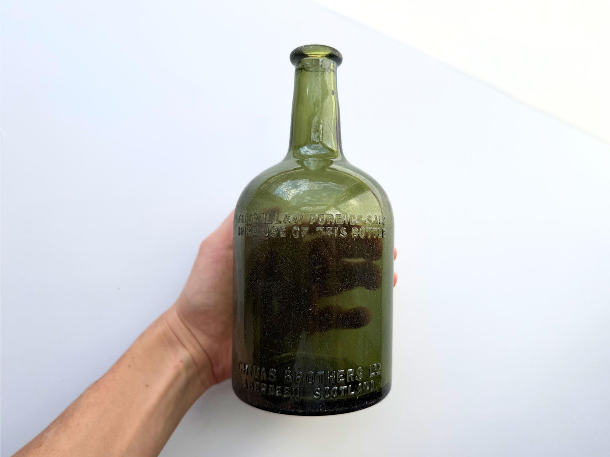 Vintage Chivas Brothers olive green scotch bottle, 8.25 inches tall, embossed with Federal Law Forbids Sale Or Re-Use Of This Bottle — hand-recovered NYC mid-century glass dated 1935 to 1964