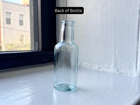 Vintage Tournades Kitchen Bouquet embossed aqua glass bottle side view – Brooklyn Sea Glass