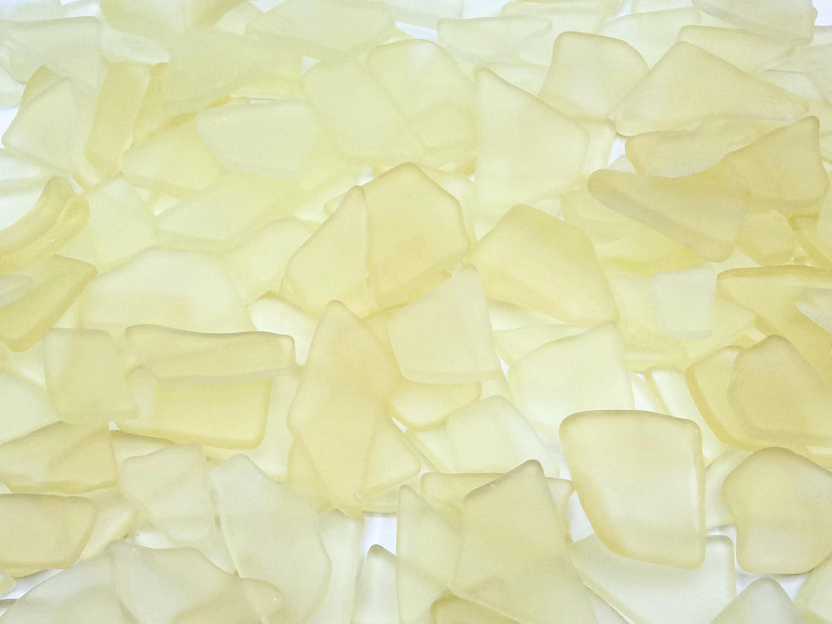 Buttercream yellow tumbled sea glass pieces with smooth frosted edges in small to medium sizes perfect for spring jewelry making mosaics resin art wedding decor and coastal home accents made from recycled vintage glass