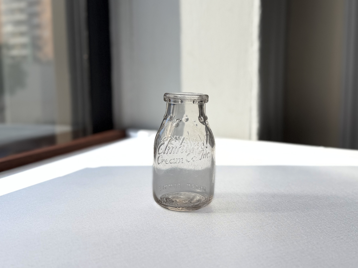 Elmhurst Cream Co. milk bottle back view showing dual-face ELMHURST CREAM CO INC embossing, 1953 Queens NY