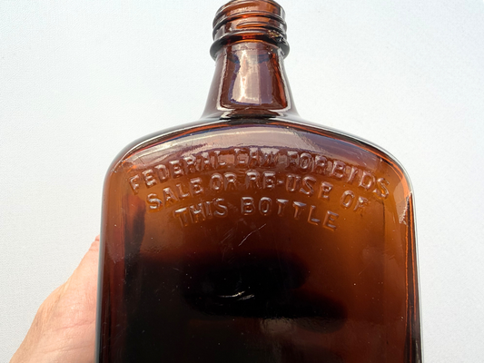 Geo. Ballantine and Sons amber glass bottle back view showing FEDERAL LAW FORBIDS SALE embossing on body