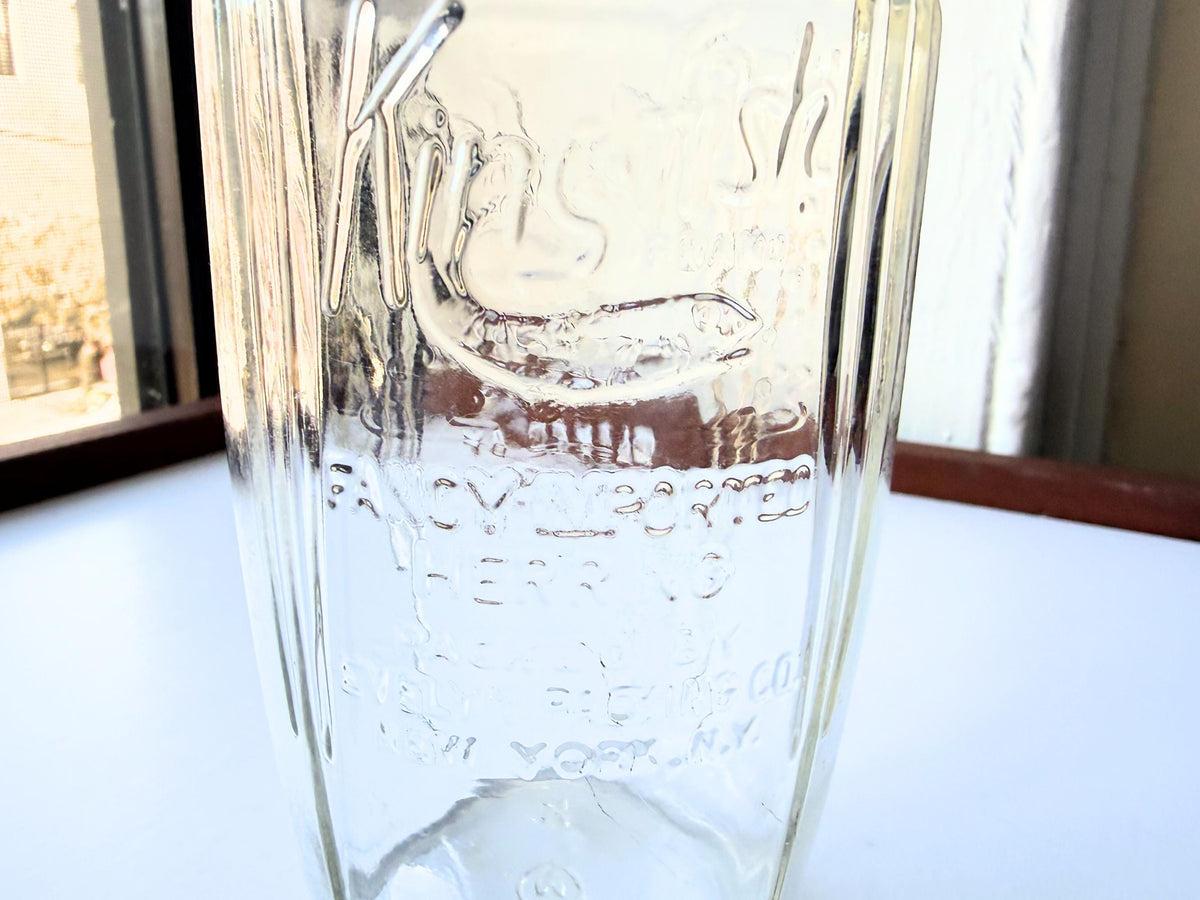 Kingfish Brand herring jar profile view by window, vintage clear embossed glass farmhouse kitchen display
