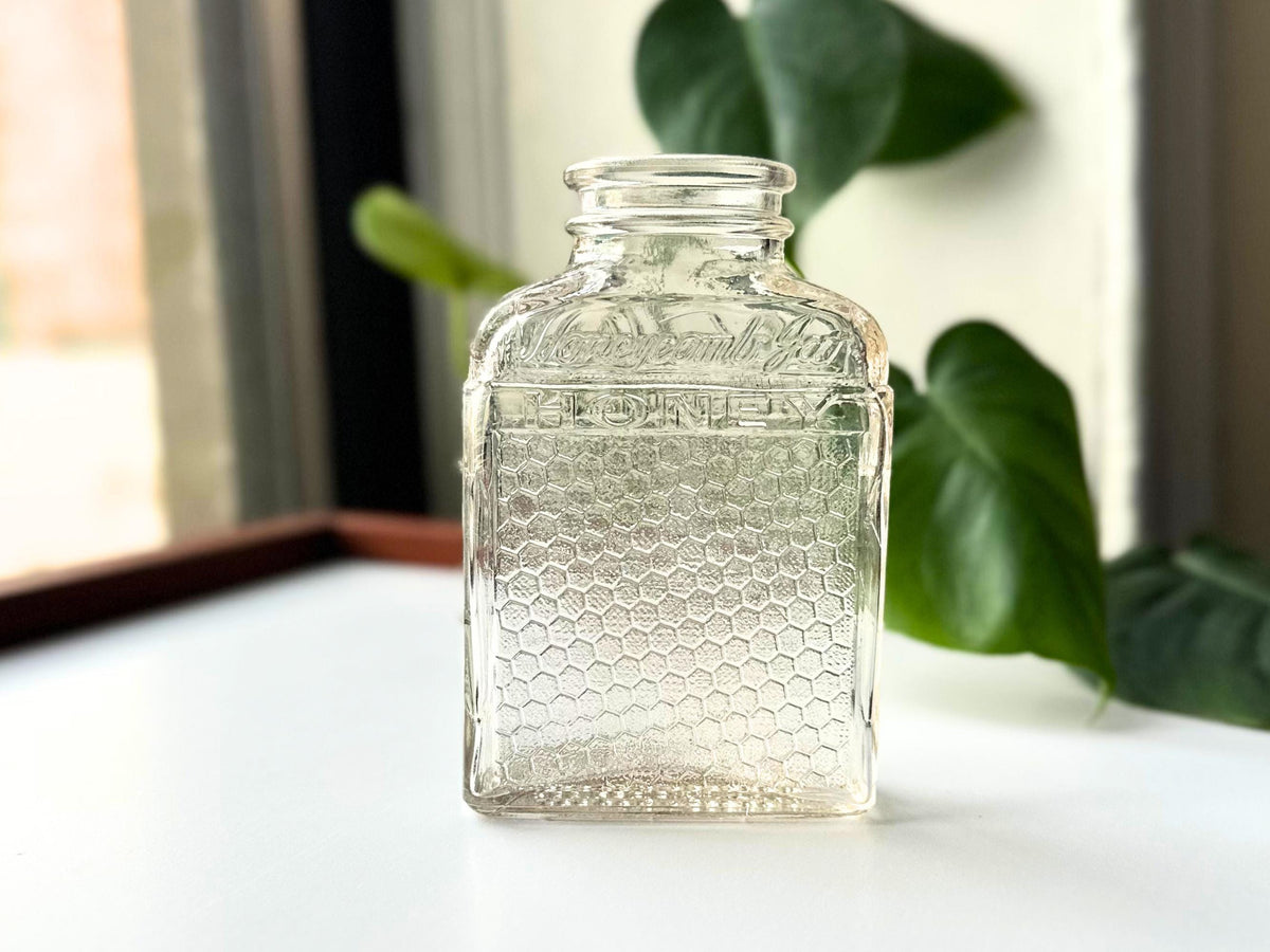 Lake Shore Honeycomb Jar full front view, 1940s pink-tinted clear glass with embossed honey branding