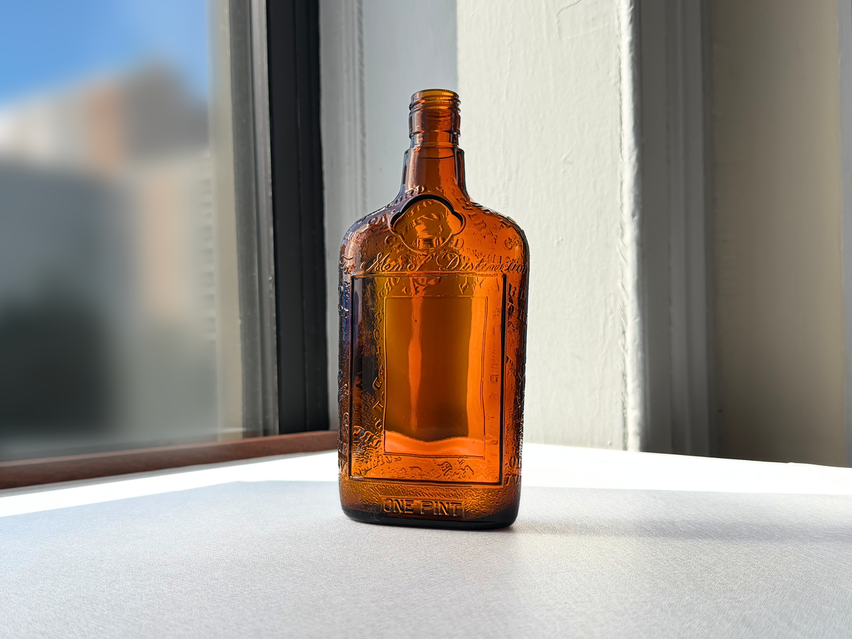 Lord Calvert 1952 amber whiskey flask with dimensions shown, Men of Distinction embossed glass bar collectible