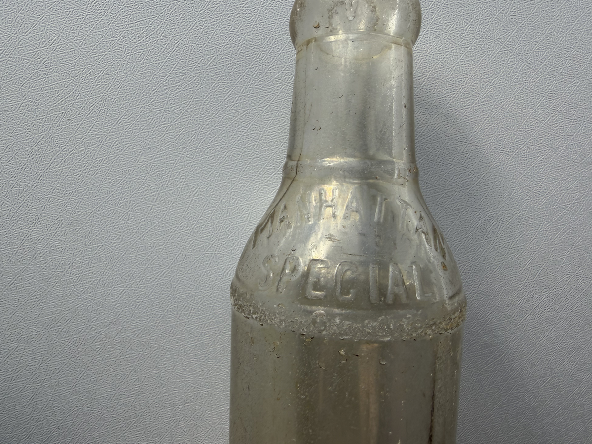 Manhattan Special soda bottle base markings detail, vintage clear glass recovered from NYC shoreline