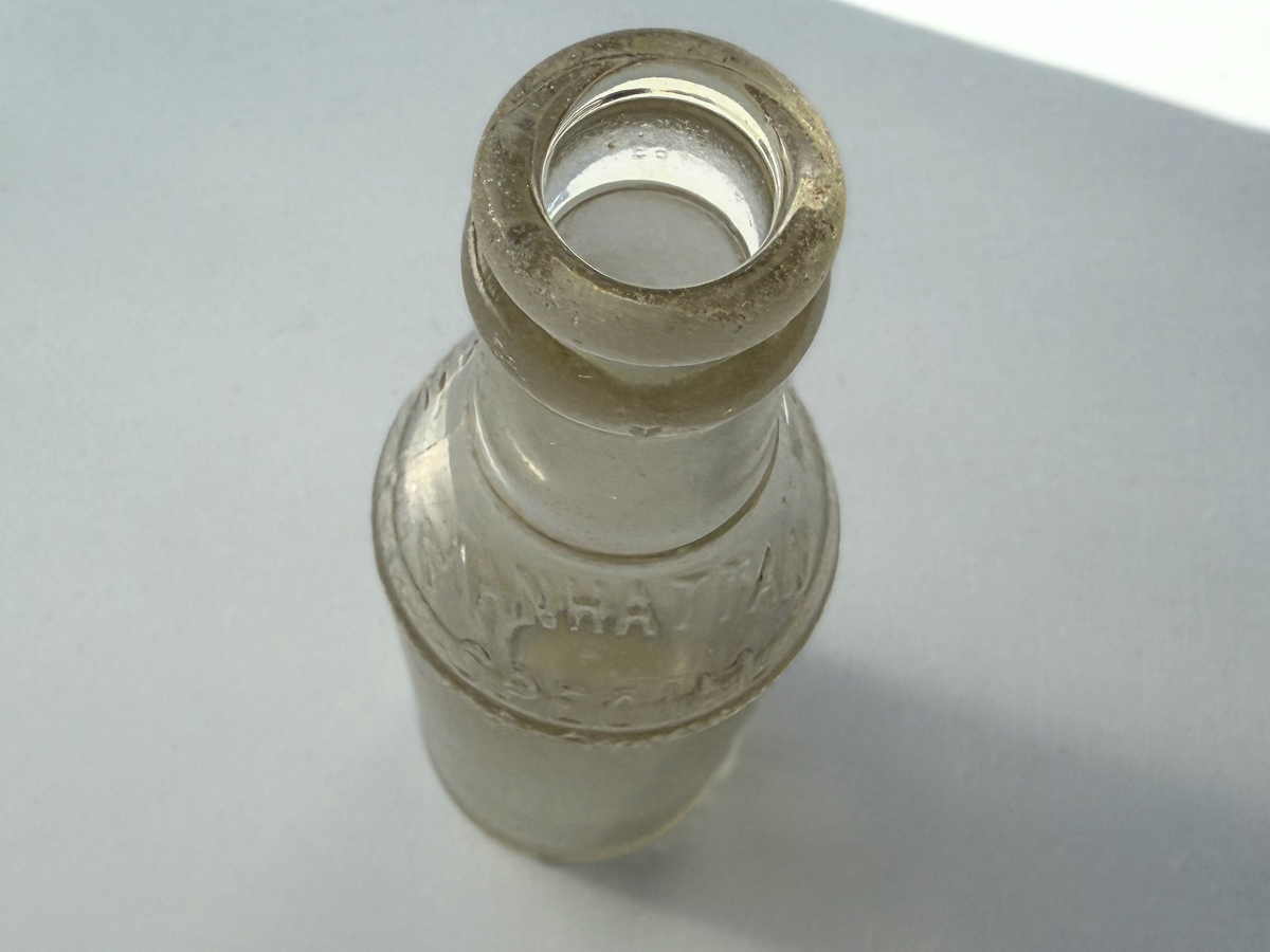 Manhattan Special soda bottle with dimensions shown, tall clear glass Brooklyn NYC collectible bud vase