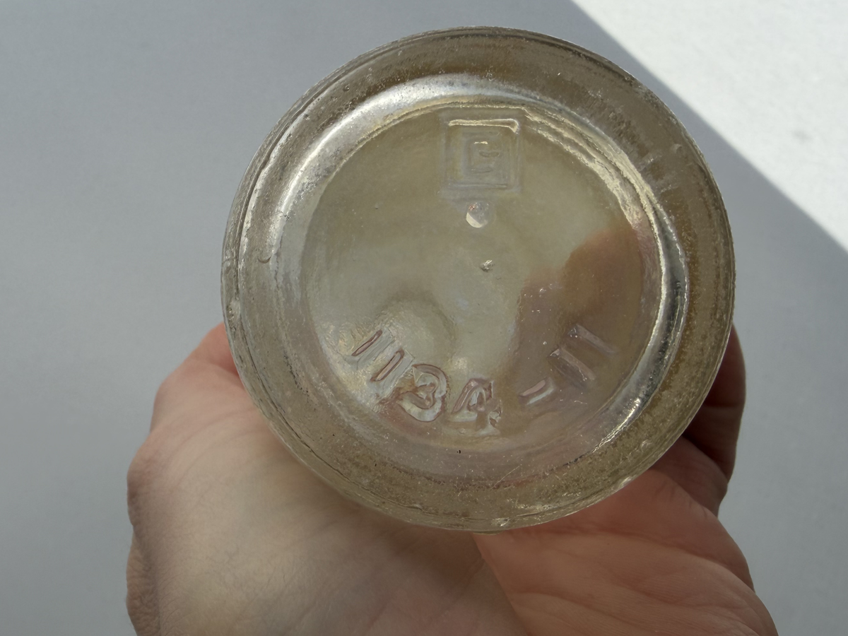 Manhattan Special soda bottle mouth and top view, vintage clear glass NYC beverage bottle