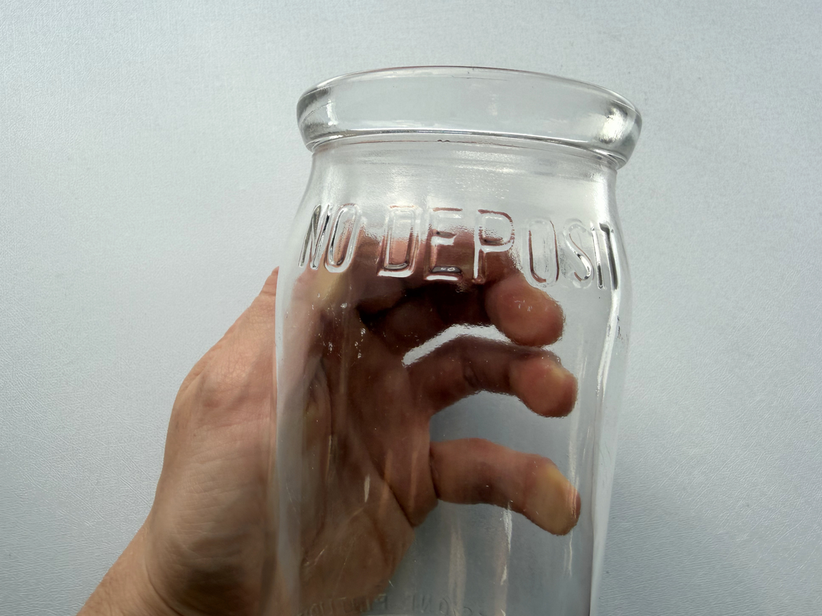 No Deposit 1954 pint milk bottle full front view by window, clear glass cottagecore bud vase