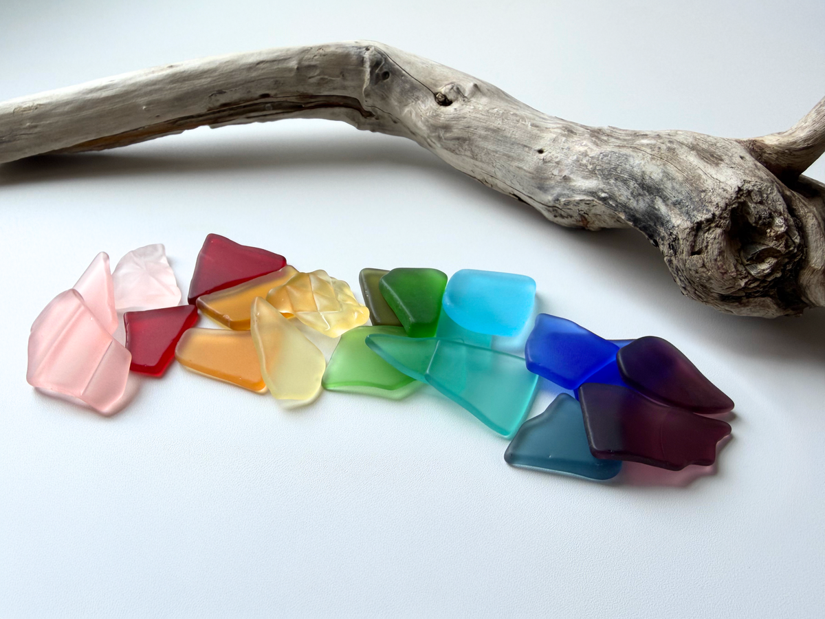 Rainbow-colored large tumbled sea glass mix ranging 0.75 to 2 inches wide in cobalt blue, amber, deep green, and red tones with smooth frosted edges, suited for bold mosaic and resin art statement pieces.