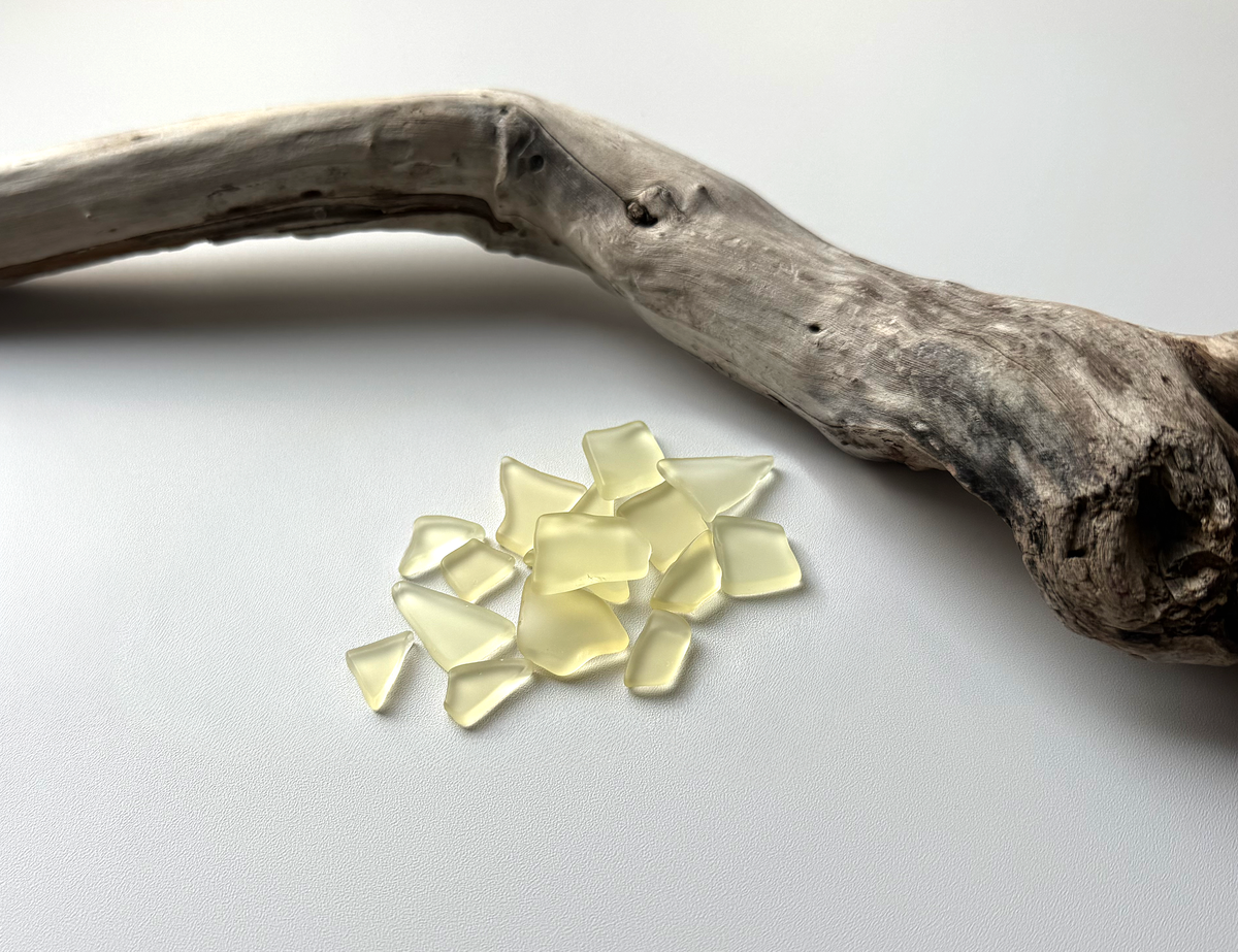 Buttercream yellow tumbled sea glass pieces with smooth frosted edges in small to medium sizes perfect for spring jewelry making mosaics resin art and pastel home decor made from recycled vintage glass