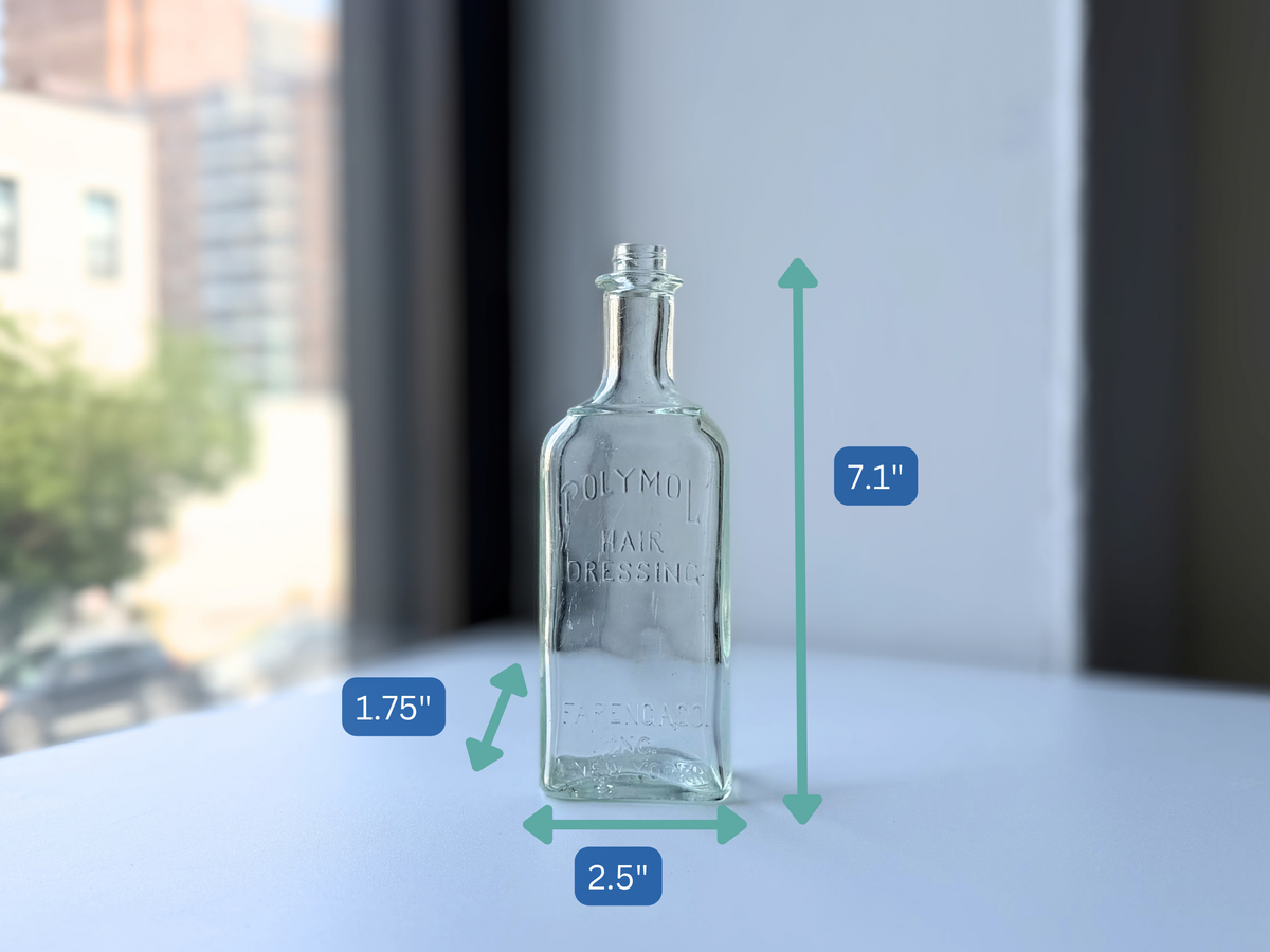 Dimensions of the vintage Polymol Hair Dressing bottle at 7.1 inches tall, 2.5 inches wide and 1.75 inches deep