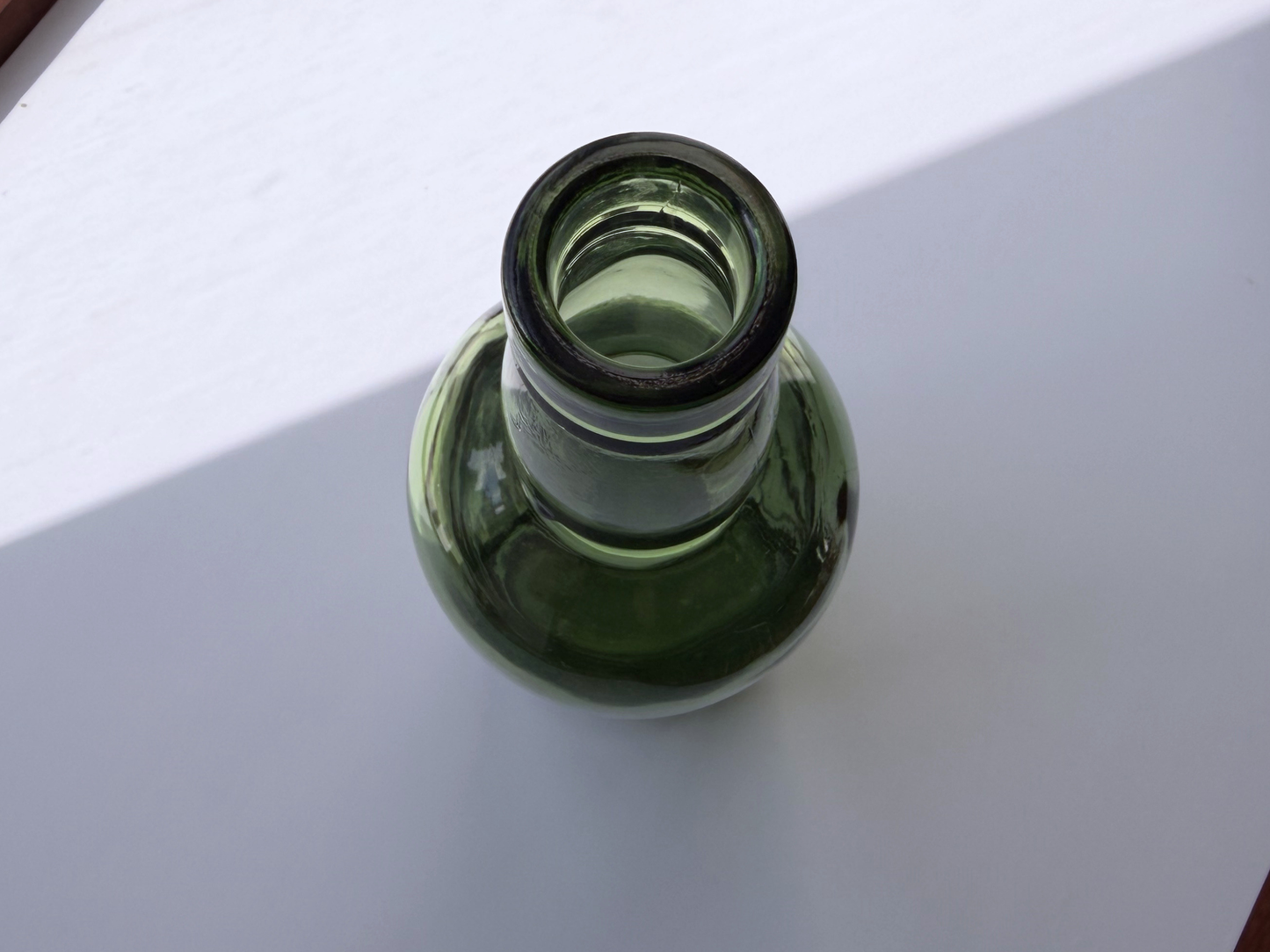 Berry Bros and Rudd London bottle back view showing FEDERAL LAW FORBIDS SALE embossing on green glass body