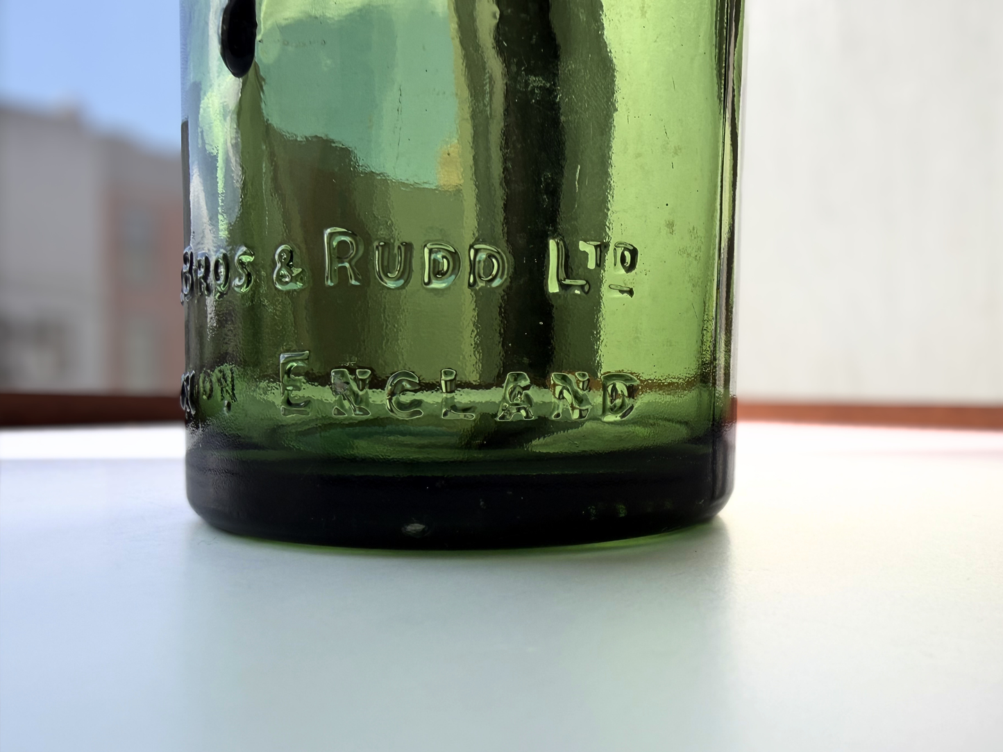 Berry Bros and Rudd bottle base showing MADE IN GREAT BRITAIN marking on bottom of green glass