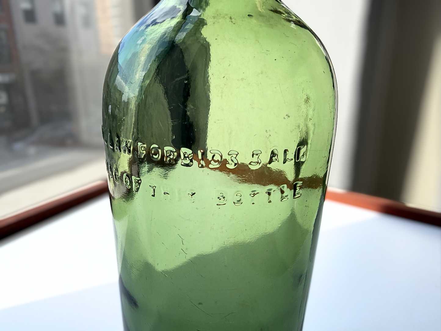 Berry Bros and Rudd London green glass bottle front angle view showing full embossed body, 11.5 inches, NYC recovery