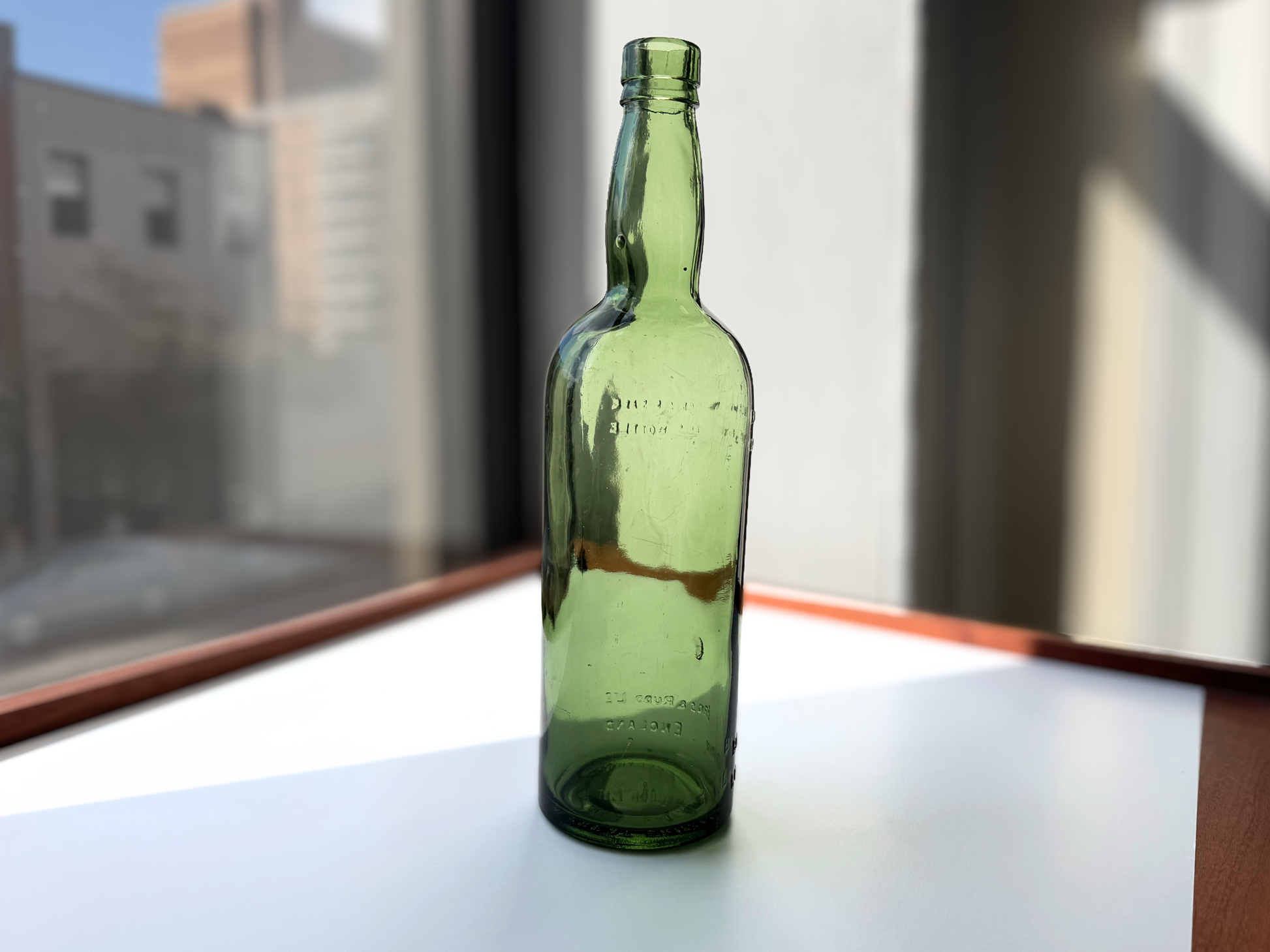 Berry Bros and Rudd London bottle full front view, green glass with embossed British spirits branding, 11.5 inches