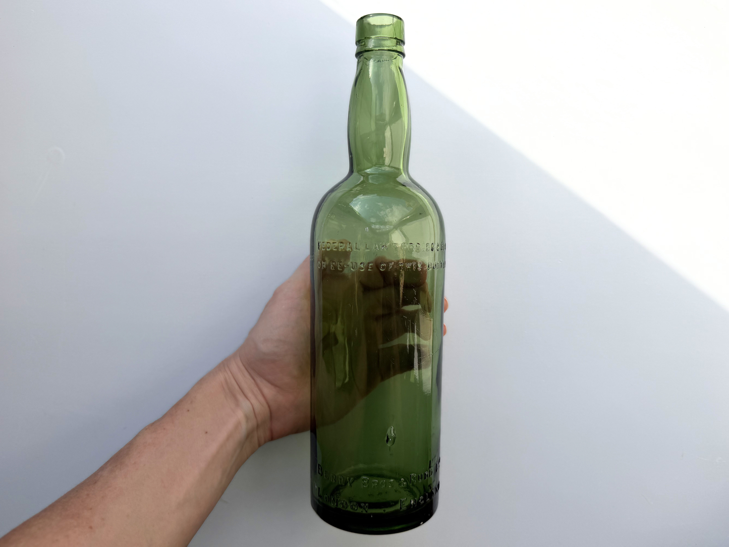 Berry Bros and Rudd green glass bottle top-down view showing mouth opening and clean green glass condition