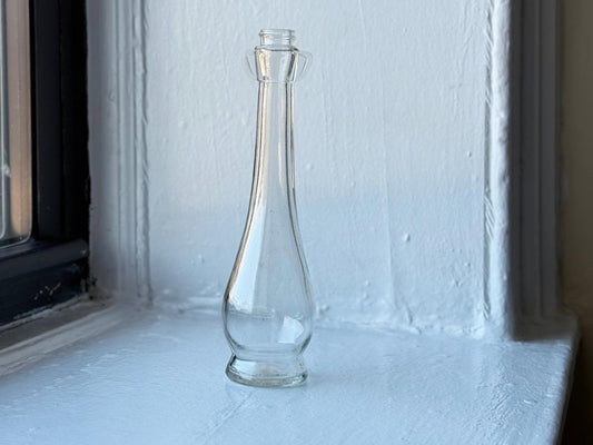 Close-up of the bulbous base of the vintage Pompeian Olive Oil bottle, emphasizing the clean, clear glass – Brooklyn Sea Glass