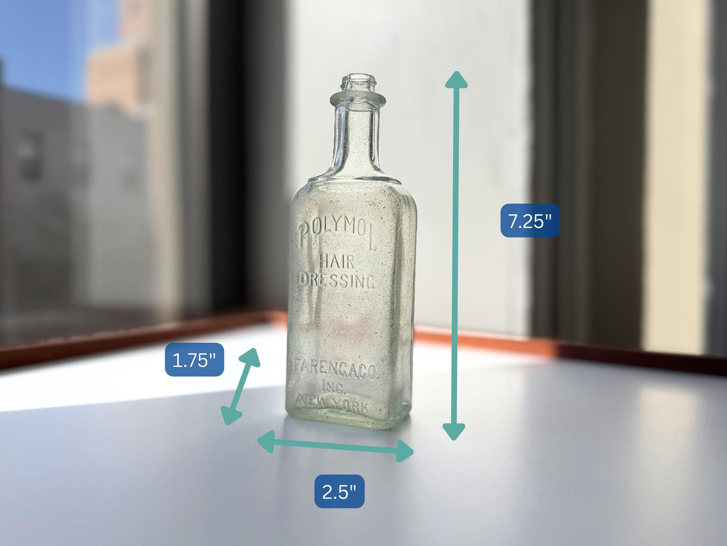 Antique aqua Polymol Hair Dressing bottle with genuine sea-worn ocean patina. Early 20th century New York glass transformed by decades at sea into frosted sea glass. Perfect beach house decor and vintage collector piece.