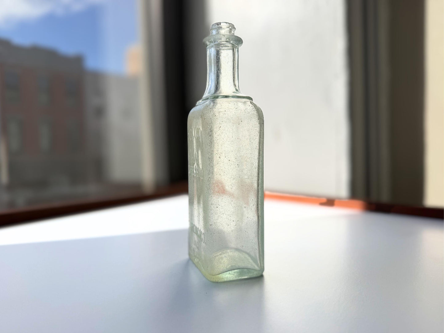Antique aqua Polymol Hair Dressing bottle with genuine sea-worn ocean patina. Early 20th century New York glass transformed by decades at sea into frosted sea glass. Perfect beach house decor and vintage collector piece.