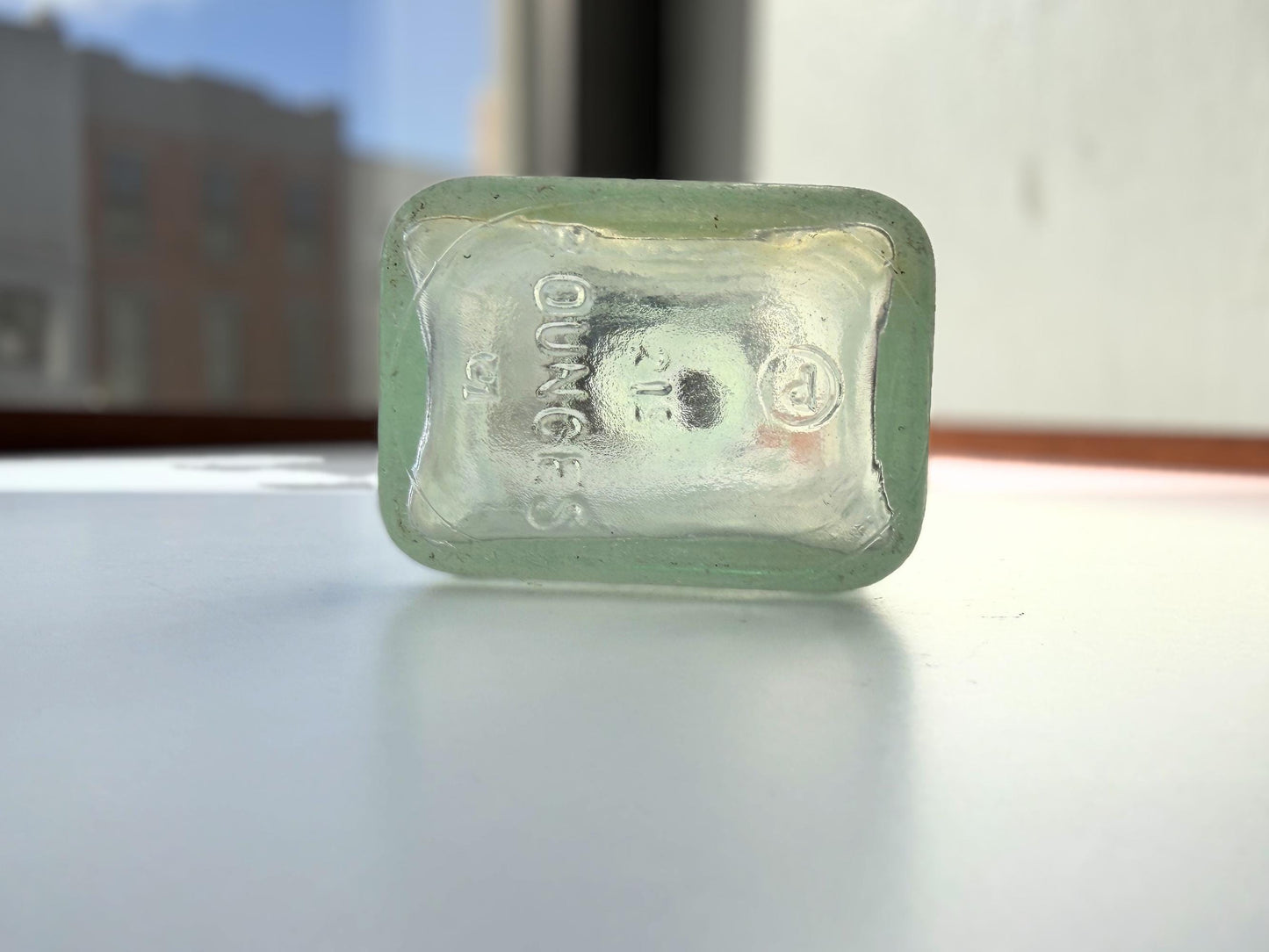 Antique aqua Polymol Hair Dressing bottle with genuine sea-worn ocean patina. Early 20th century New York glass transformed by decades at sea into frosted sea glass. Perfect beach house decor and vintage collector piece.