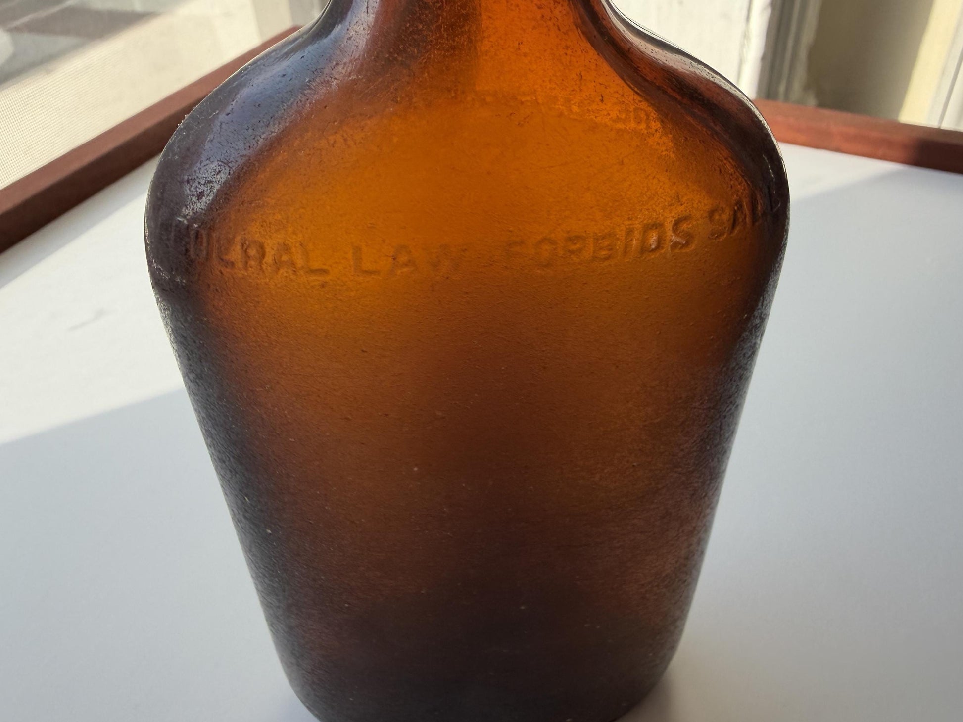 Authentic 1953 amber pint flask 7.75 inches tall with heavy all-over sea-worn patina and Federal Law embossing - genuine beach-found NYC sea glass hand-recovered from NYC shorelines