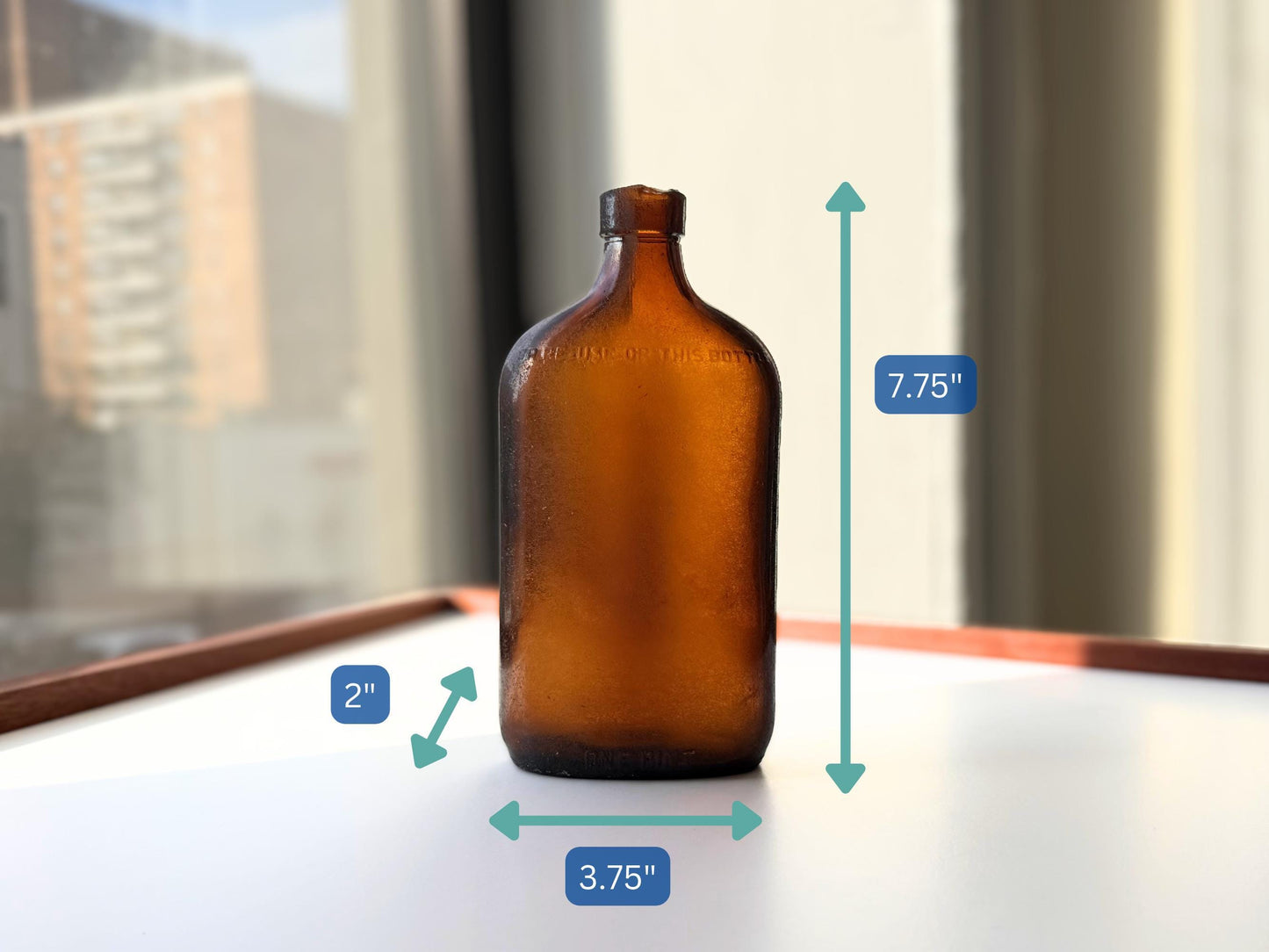 Authentic 1953 amber pint flask 7.75 inches tall with heavy all-over sea-worn patina and Federal Law embossing - genuine beach-found NYC sea glass hand-recovered from NYC shorelines