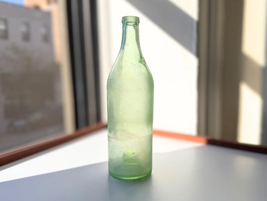 Vintage seaworn Bacardi rum bottle with beautiful frosted patina from ocean exposure. Minor chips showing authentic age. Perfect for sea glass and vintage spirits collectors.