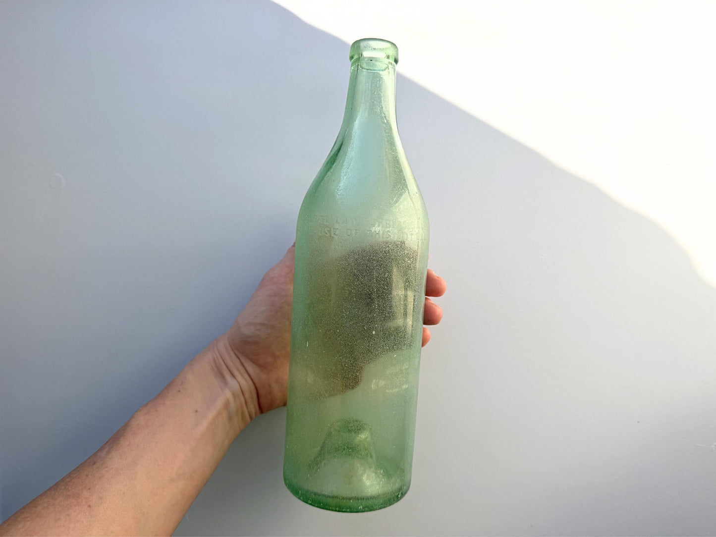 Vintage seaworn Bacardi rum bottle with beautiful frosted patina from ocean exposure. Minor chips showing authentic age. Perfect for sea glass and vintage spirits collectors.