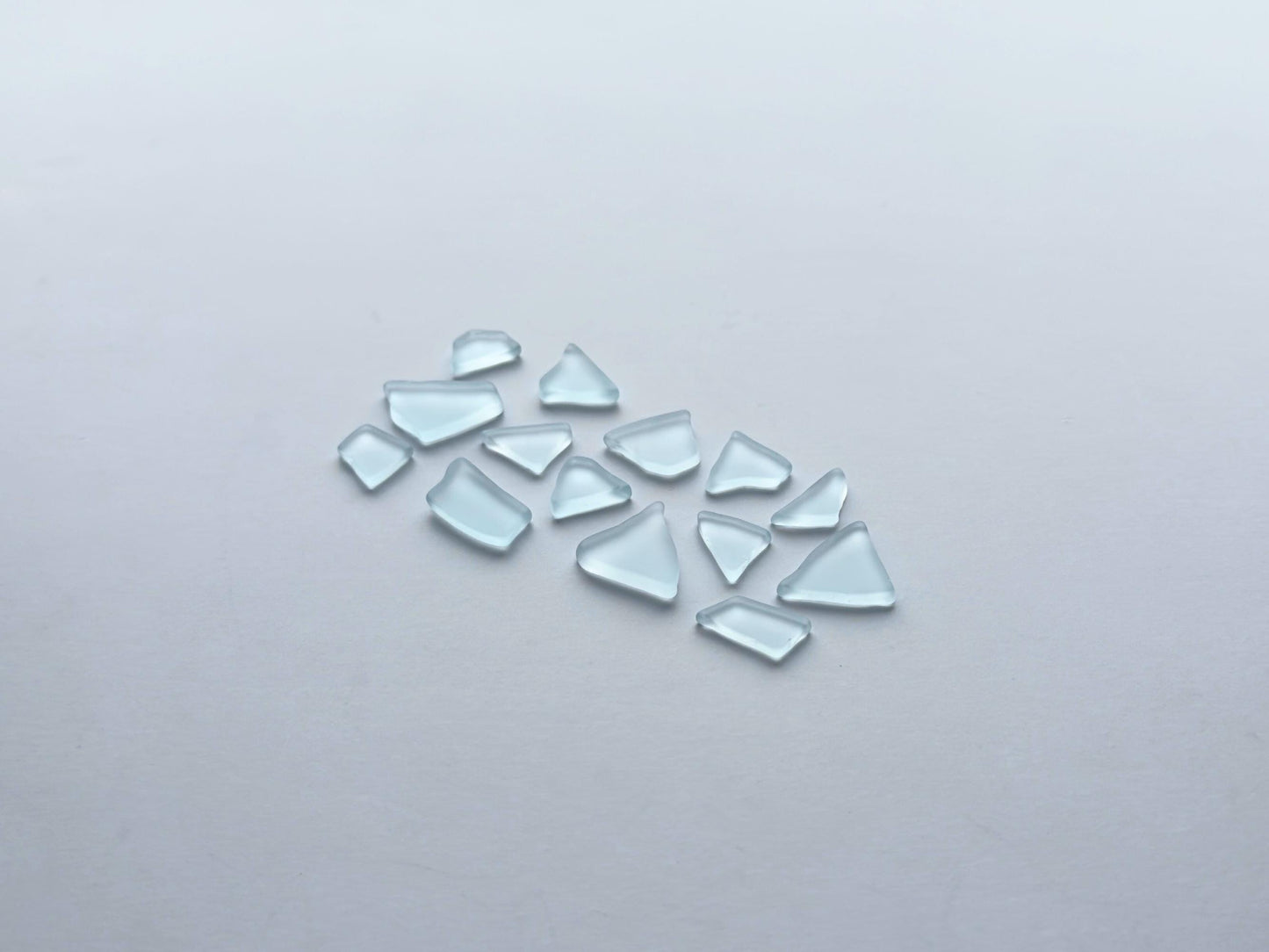 Spring sky blue tumbled sea glass pieces with smooth frosted edges in small to medium sizes perfect for spring jewelry making mosaics resin art coastal decor and nautical home accents made from recycled vintage glass