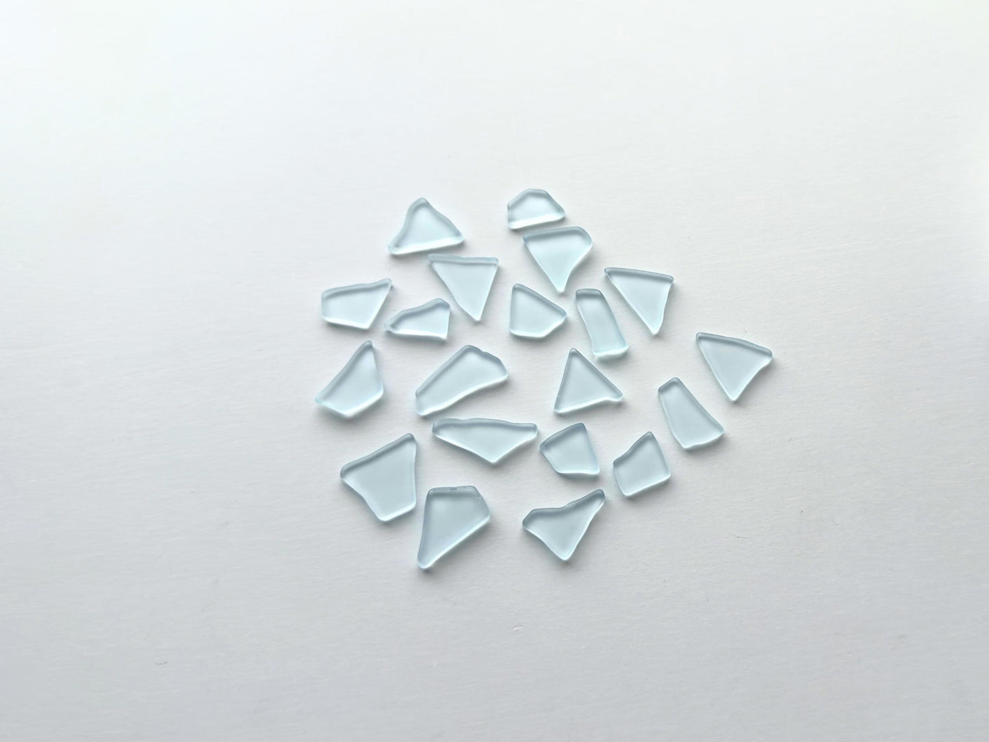 Spring sky blue tumbled sea glass pieces with smooth frosted edges in small to medium sizes perfect for spring jewelry making mosaics resin art coastal decor and nautical home accents made from recycled vintage glass