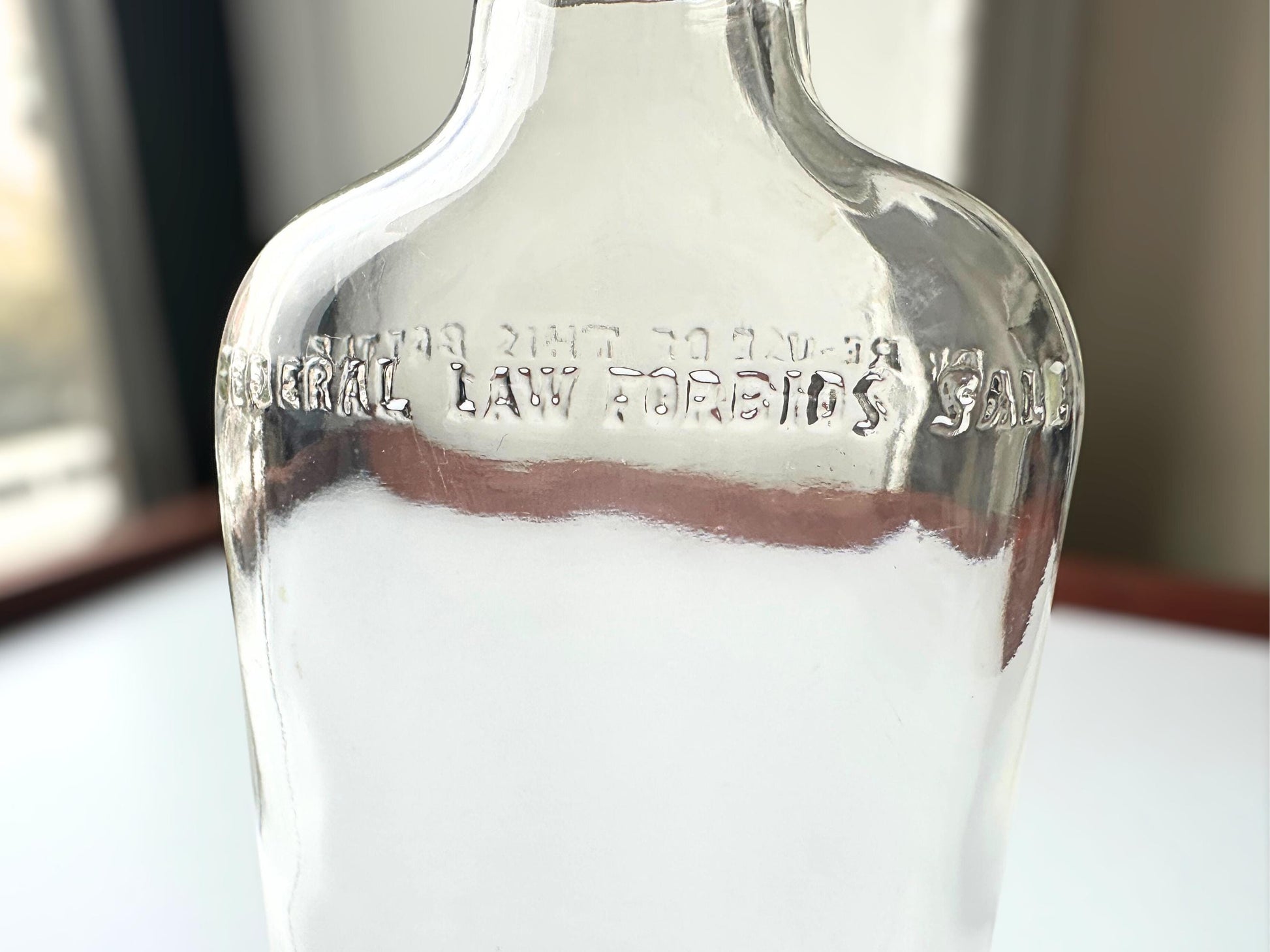 Vintage 1950 Clear Glass Flask Bottle Federal Law – lifestyle shot – Brooklyn Sea Glass