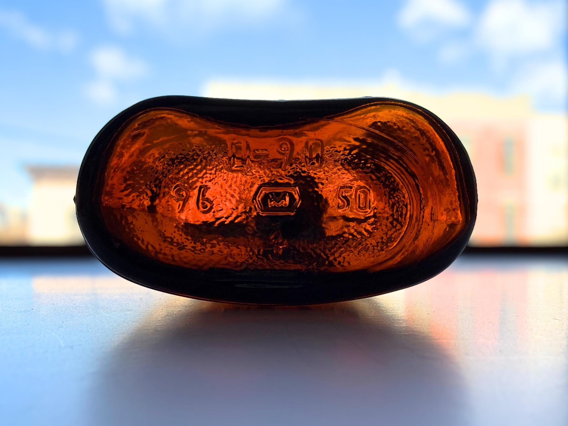 Vintage 1950s amber glass flask close-up – Brooklyn Sea Glass