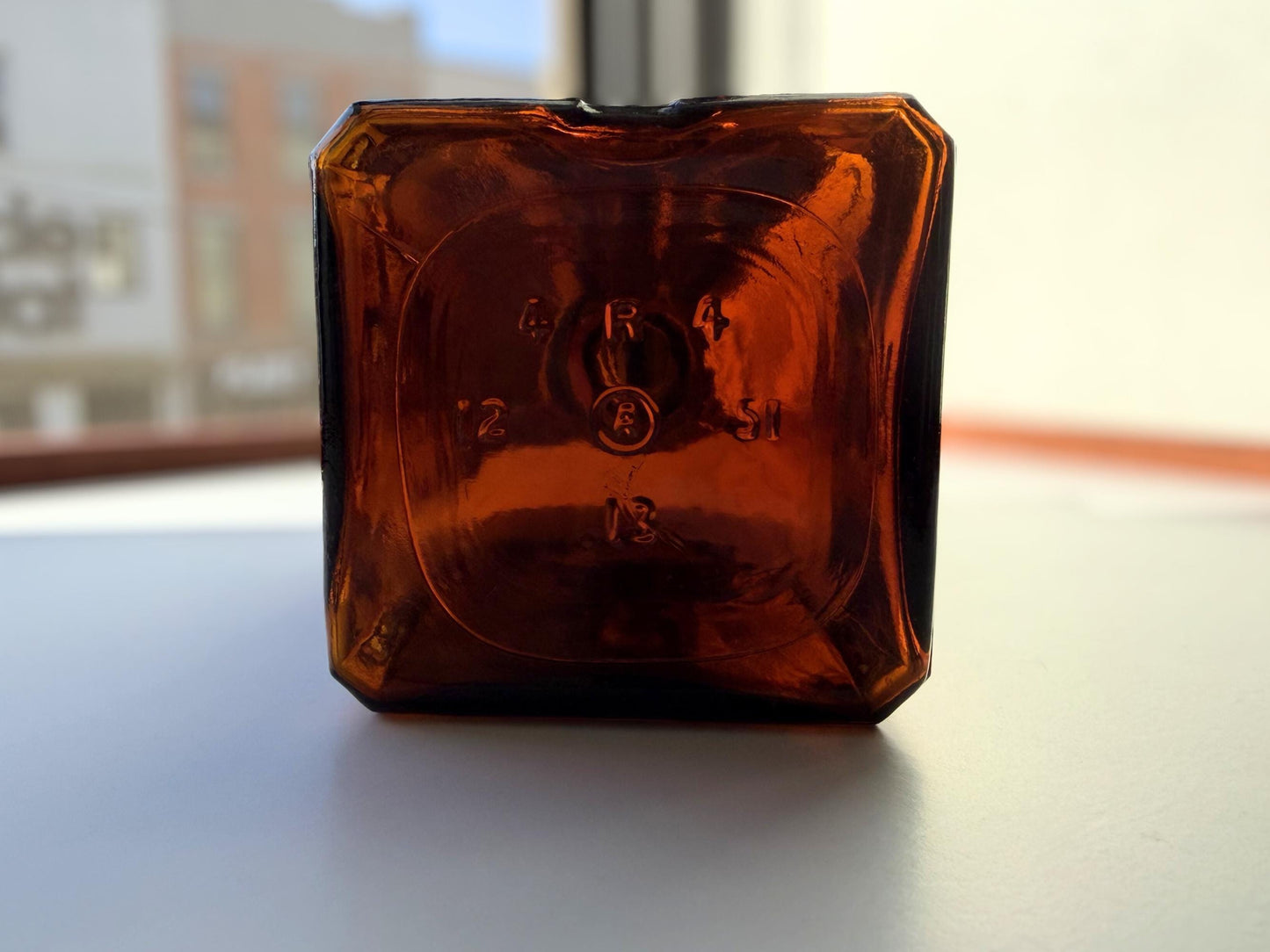 Vintage 1951 large amber Cointreau bottle with 51 production marking. Perfect for spirits collectors, bar displays, and vintage liqueur enthusiasts.