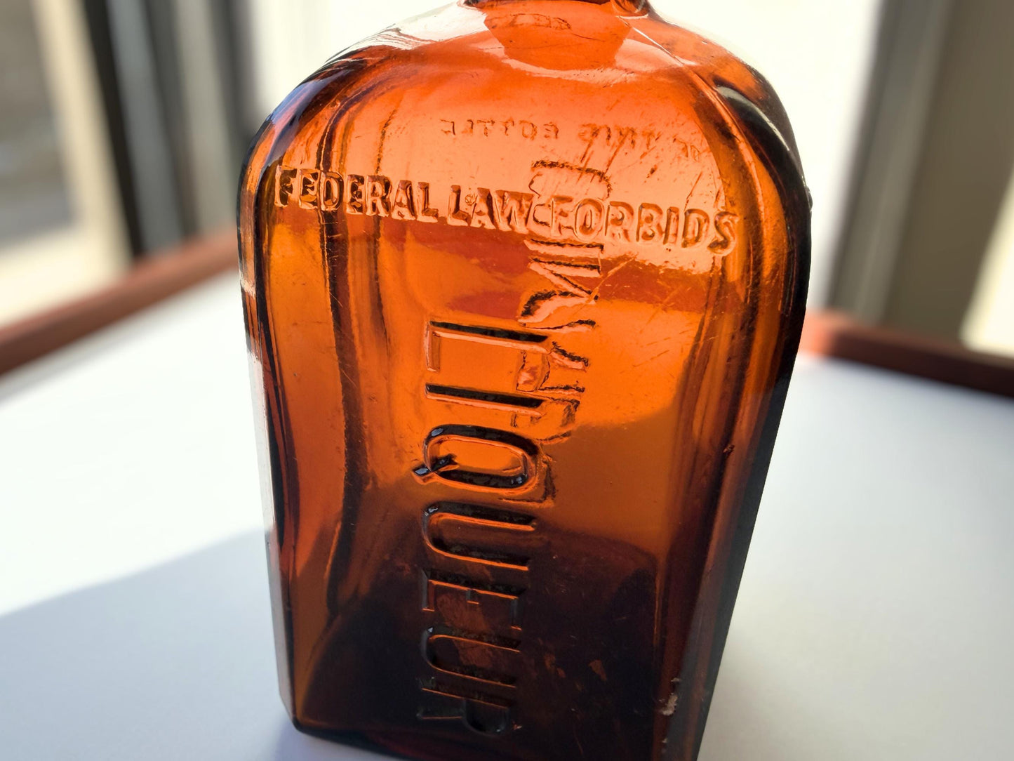 Vintage 1951 large amber Cointreau bottle with 51 production marking. Perfect for spirits collectors, bar displays, and vintage liqueur enthusiasts.