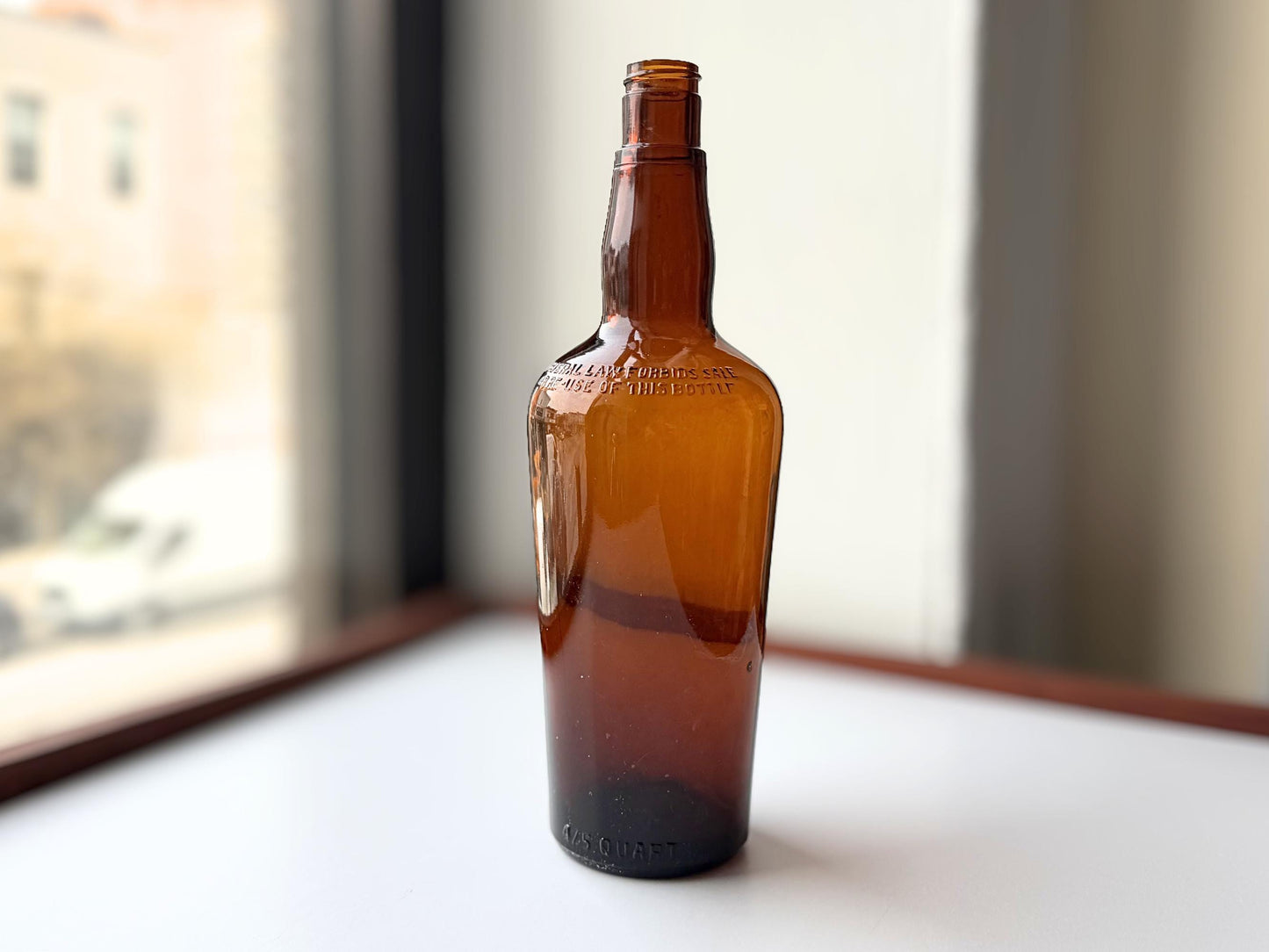 Vintage 1951 wide shoulder whisky bottle with distinctive shape and Owens Illinois marking. Excellent condition. Perfect for collectors of unusual bottle shapes.