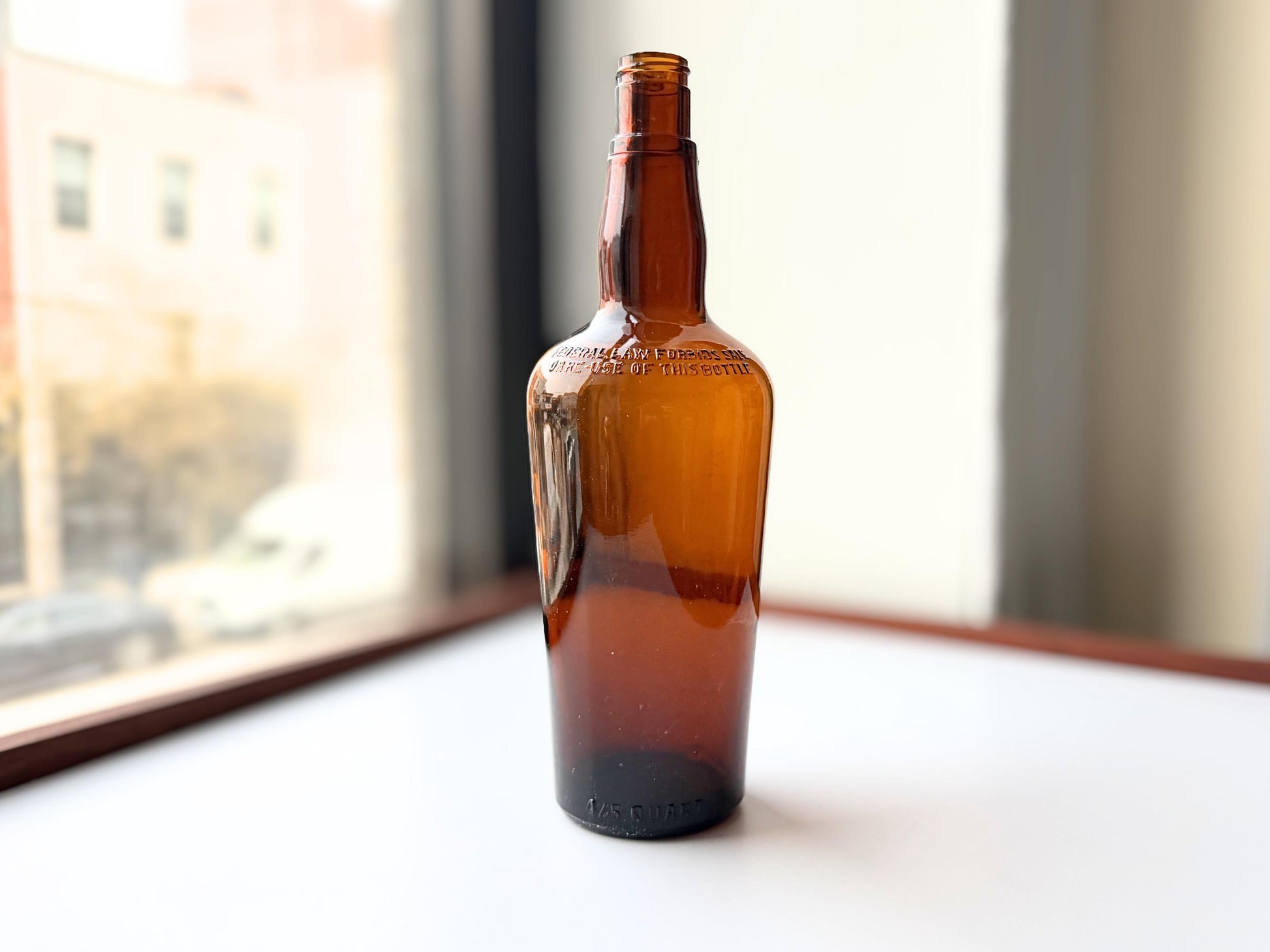 Vintage 1951 wide shoulder whisky bottle with distinctive shape and Owens Illinois marking. Excellent condition. Perfect for collectors of unusual bottle shapes.